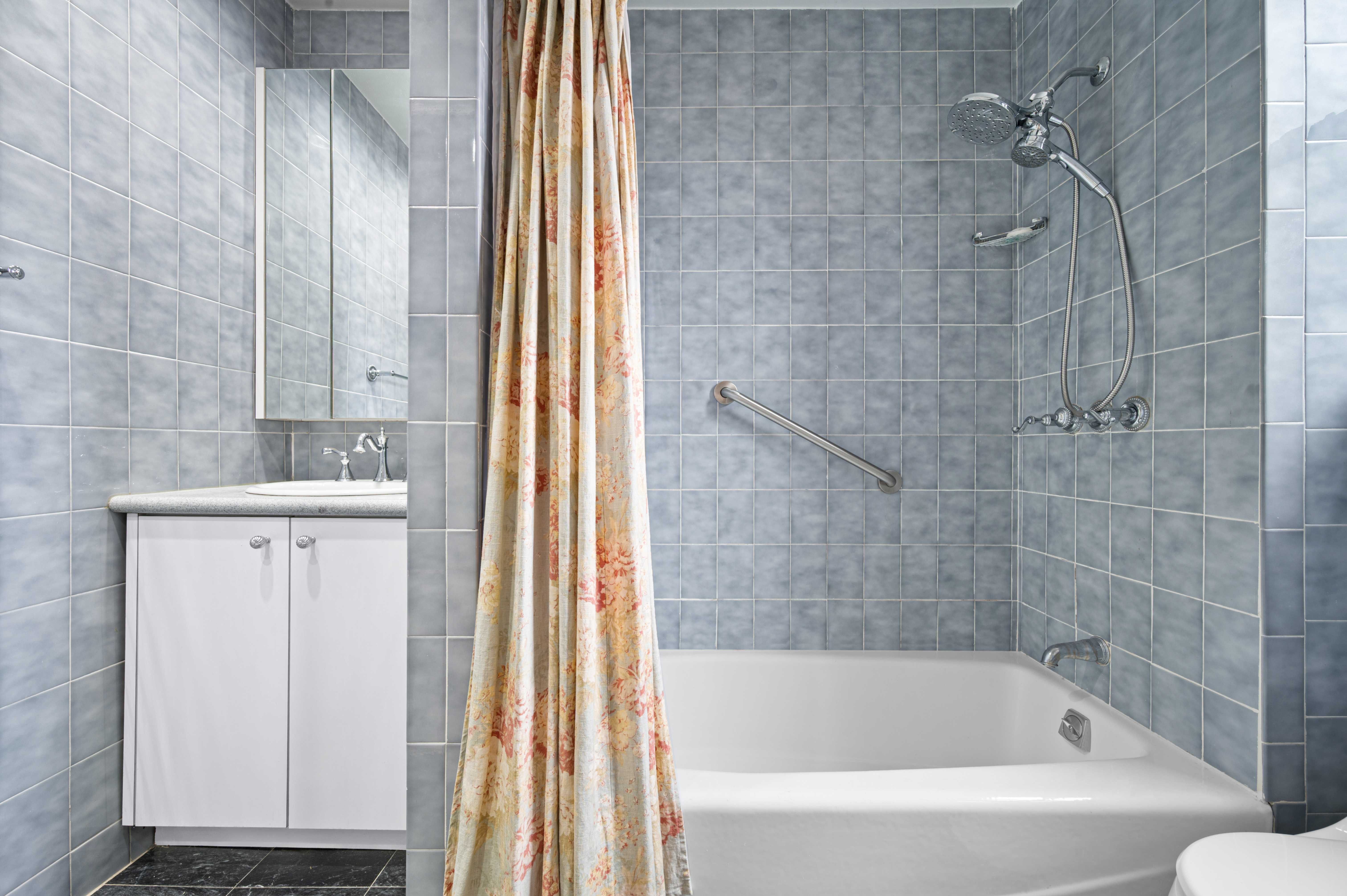 325 East 57th Street, Unit 11D Manhattan, NY 10022 - Photo 11 of 13 a bathroom with a bathtub and a sink