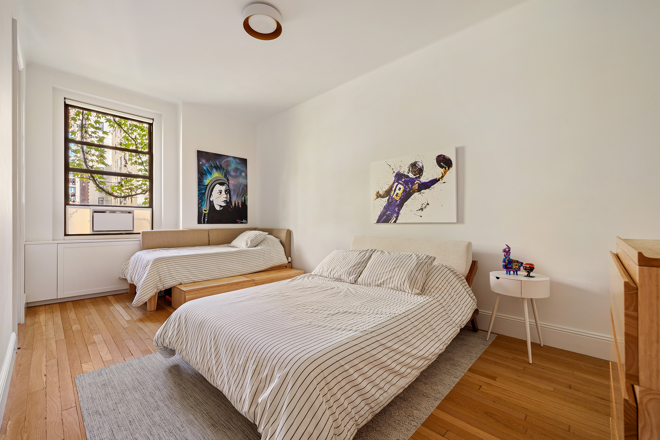 210 West 90th Street, Unit 8L Manhattan, NY 10024 - Photo 9 of 21 a bedroom with two beds and a window