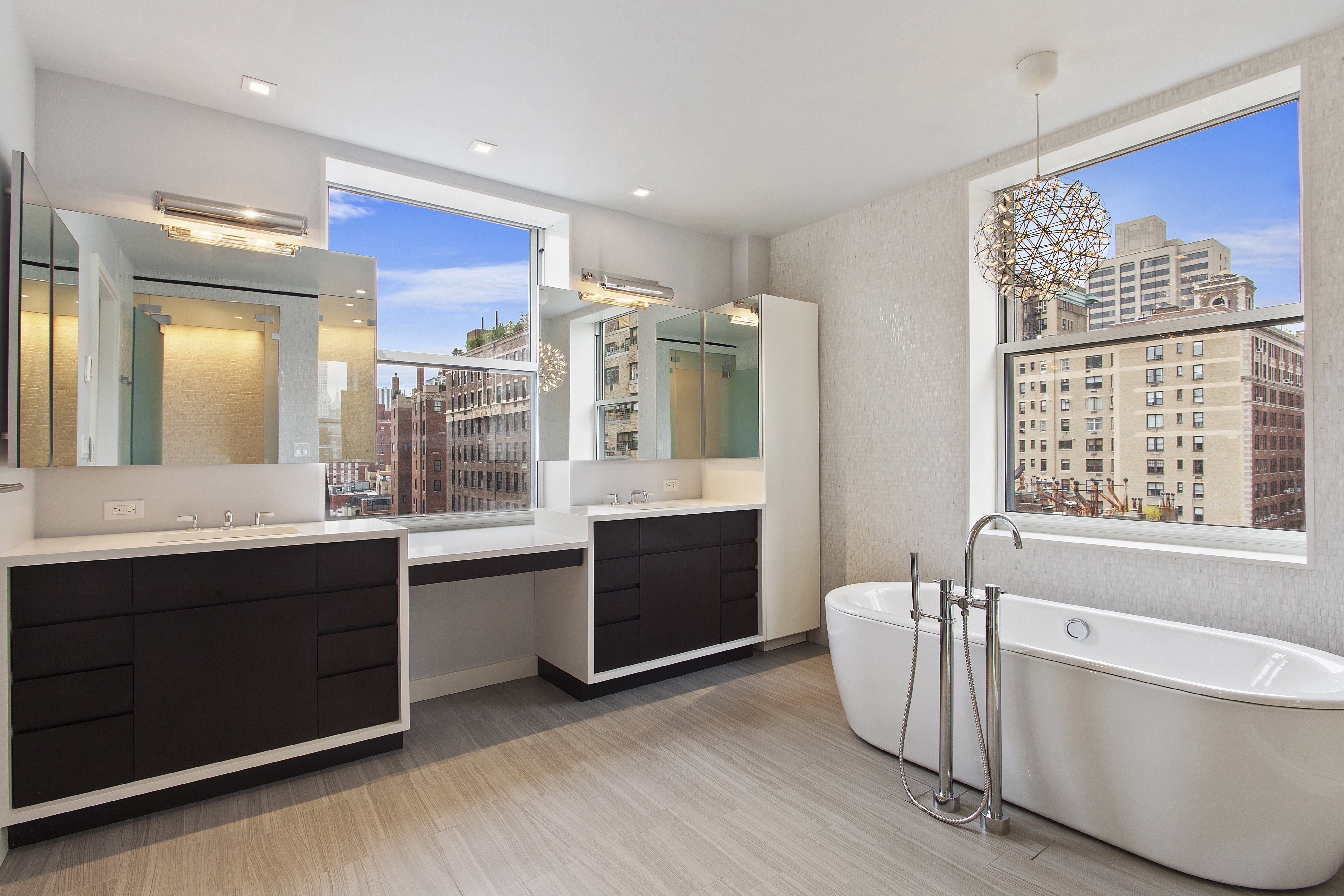 East 80th Street Manhattan, NY 10075 - Photo 6 of 13 a large bathroom with a large tub and sink