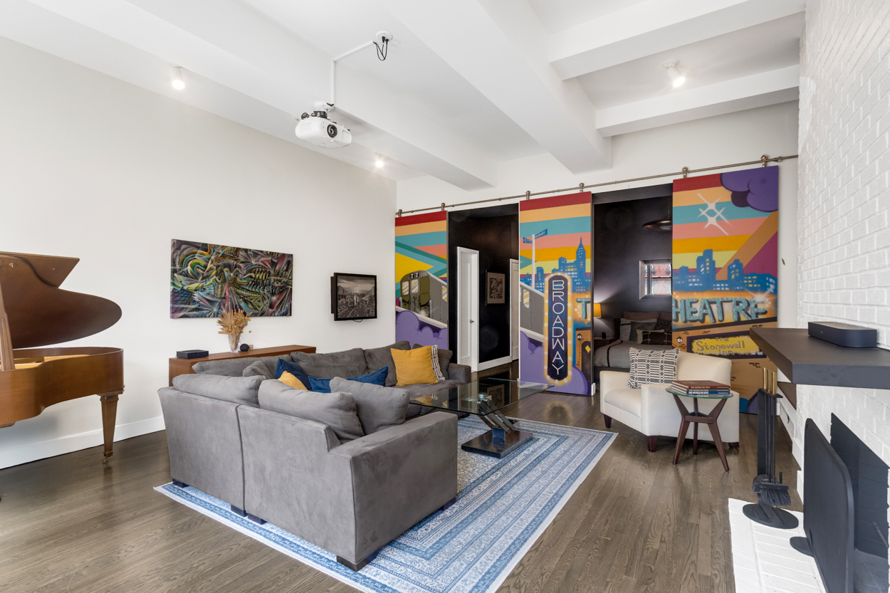 521 West 47th Street, Unit 3A Manhattan, NY 10036 - Photo 5 of 13 a living room with furniture and wooden floor
