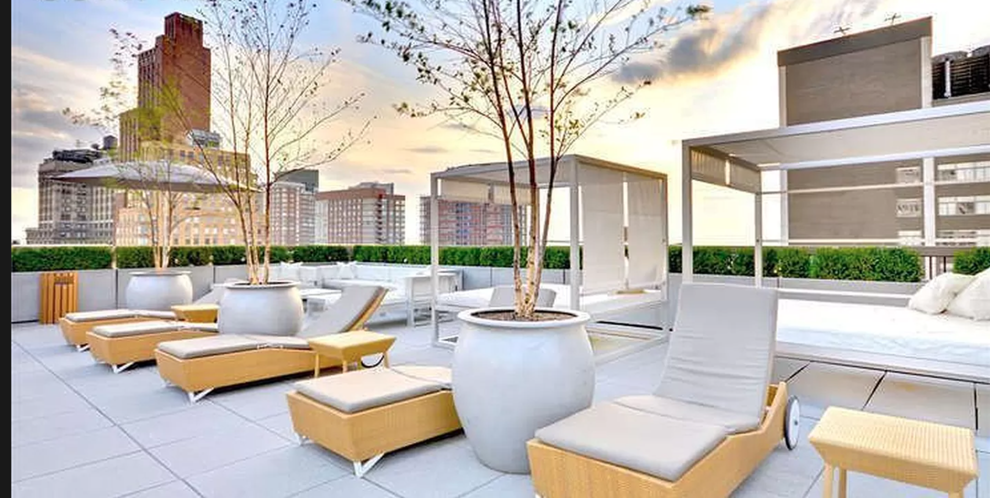 88 Greenwich Street, Unit 911 Manhattan, NY 10006 - Photo 6 of 10 a view of a patio with couches and a table and chairs with wooden fence