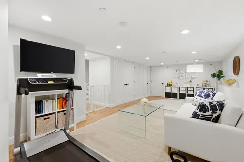a living room with lots of furniture and a flat screen tv