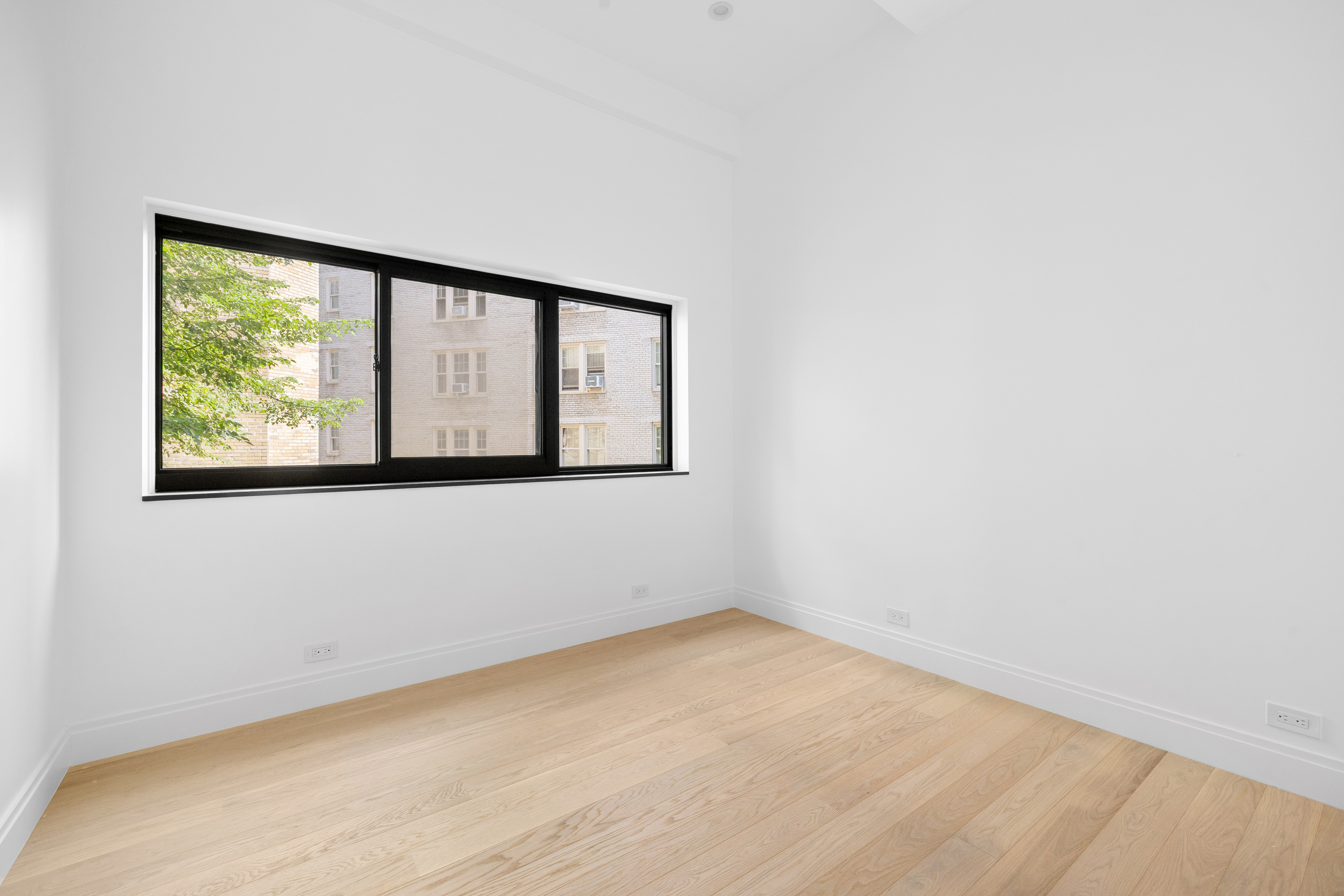 69 Bank Street, Unit 203 Manhattan, NY 10014 - Photo 18 of 23 a view of an empty room with a window