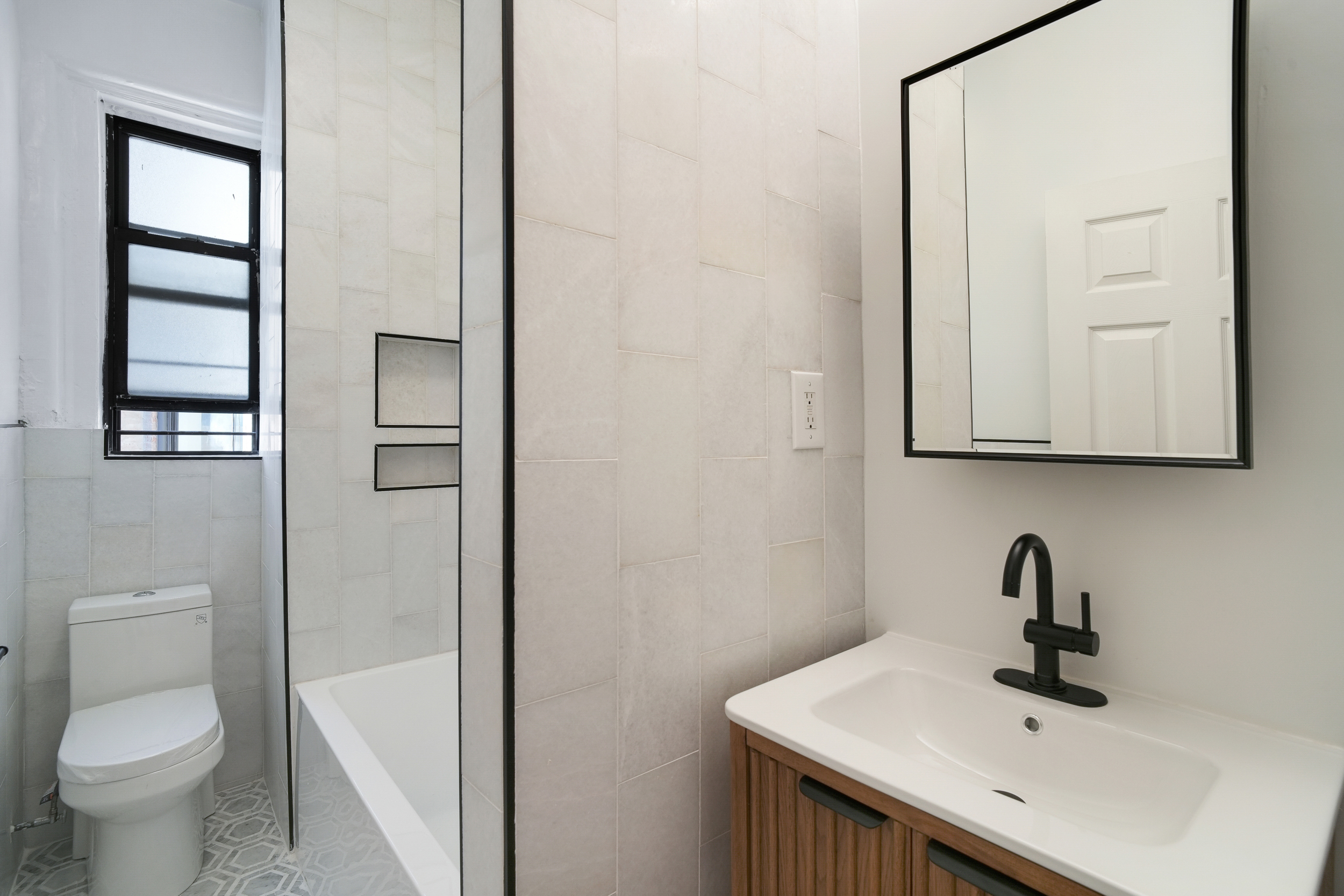 200 West 109th Street, Unit C1 Manhattan, NY 10025 - Photo 7 of 16 a bathroom with a sink and a toilet