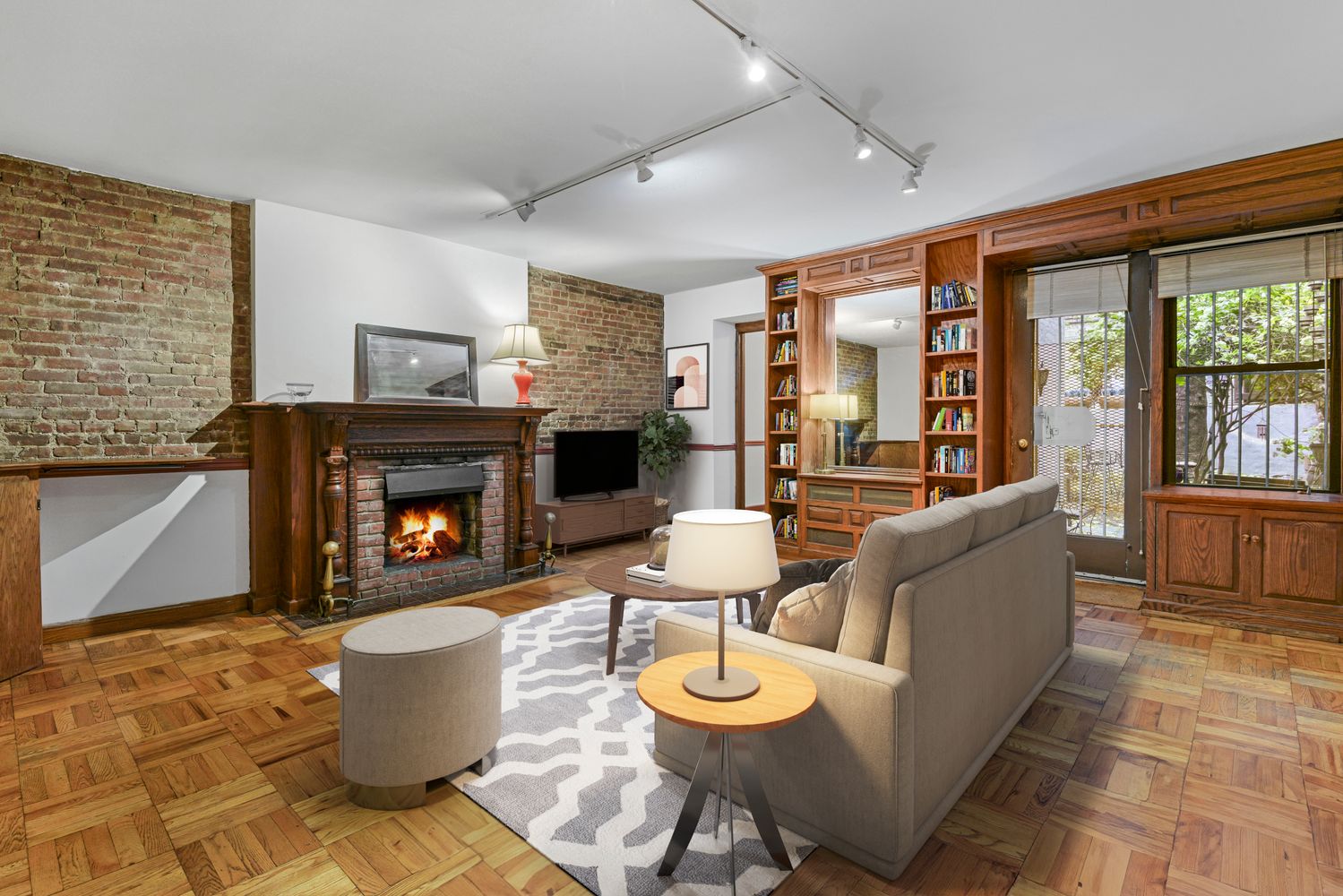 a living room with patio furniture and a fireplace