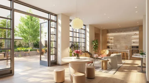 a very nice looking living room with a large window and dining table