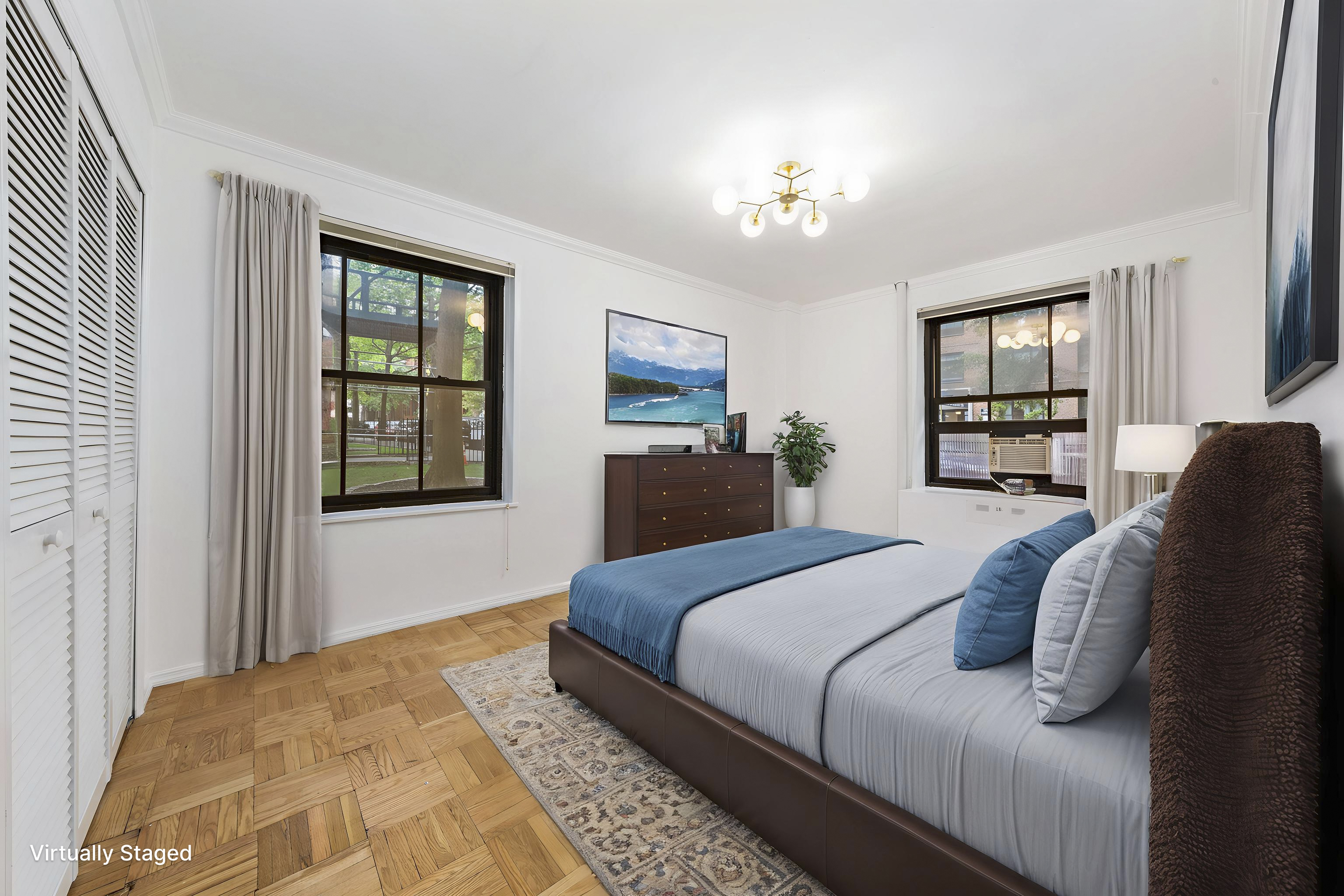 355 Clinton Avenue, Unit F1 Brooklyn, NY 11238 - Photo 6 of 20 a bedroom with a large bed and a window