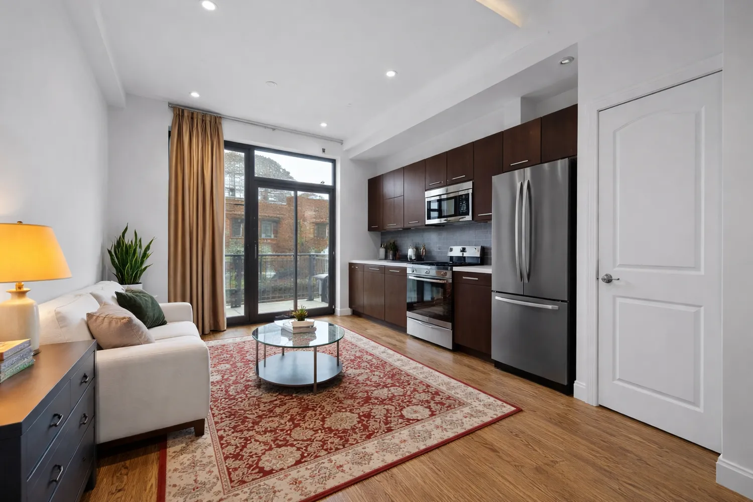a kitchen with a refrigerator a sink and a stove