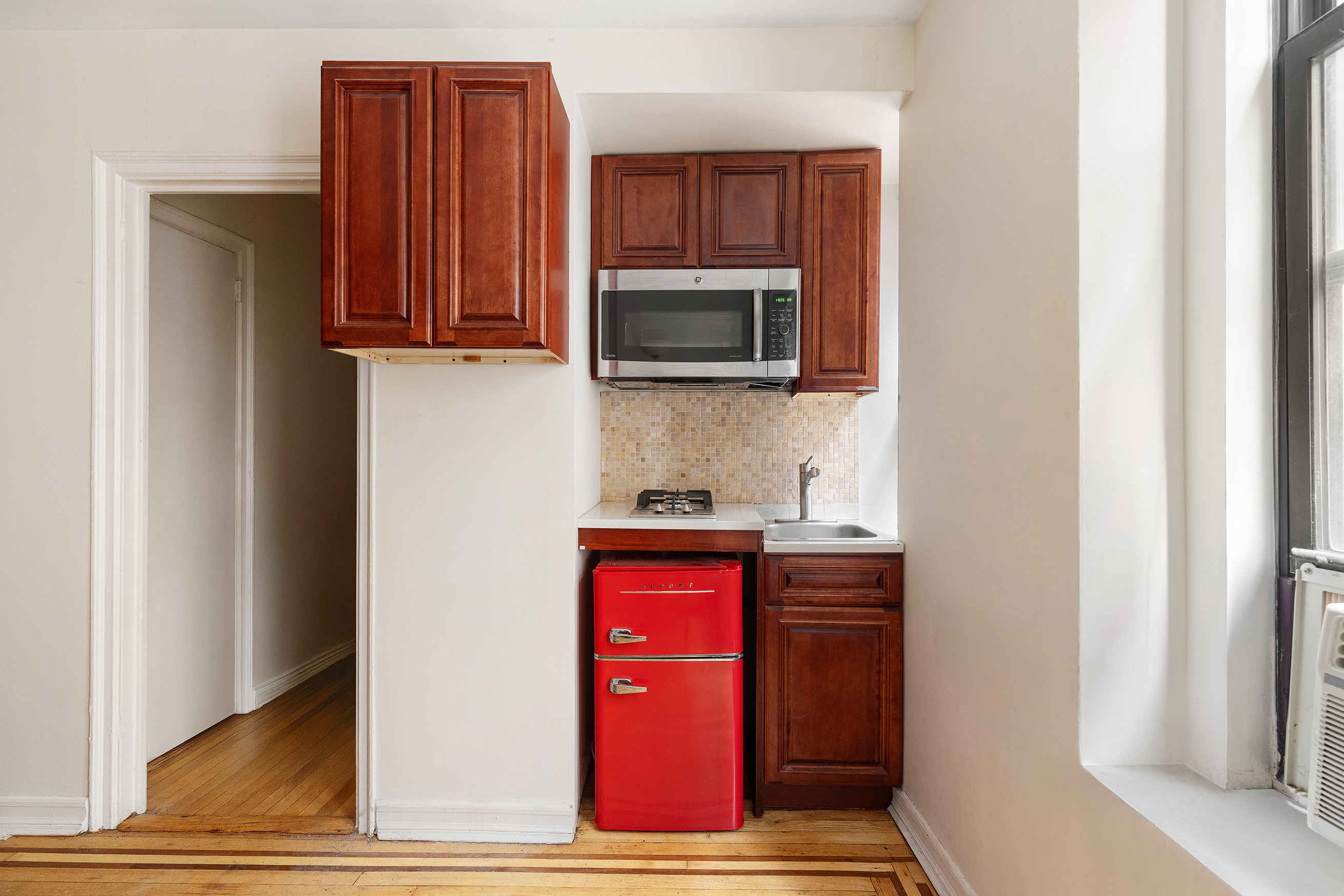 300 8th Avenue, Unit 4G Brooklyn, NY 11215 - Photo 3 of 6 a kitchen with stainless steel appliances granite countertop a refrigerator and microwave