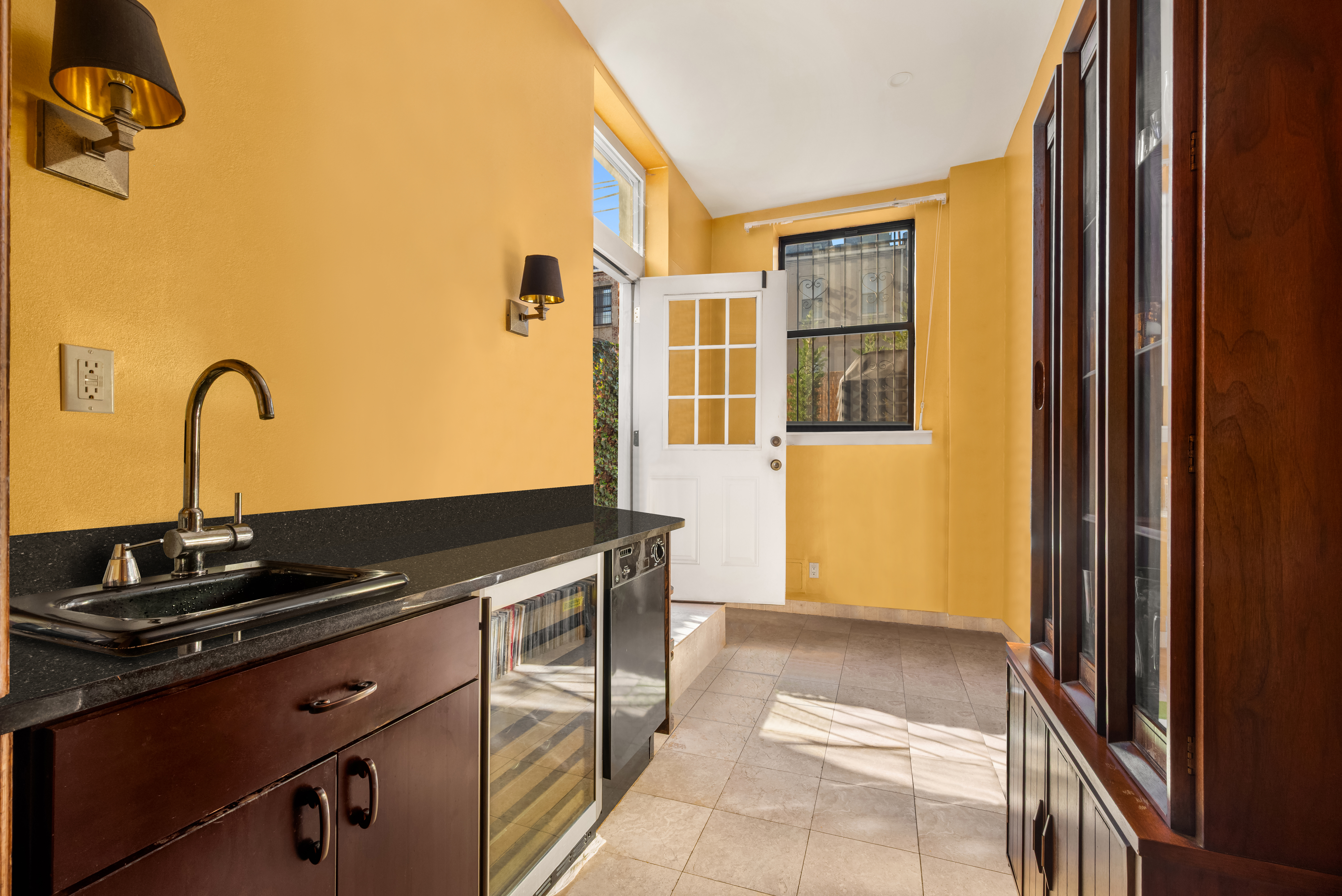 226 West 139th Street Boston, NY 10030 - Photo 8 of 14 a kitchen with a sink and a refrigerator