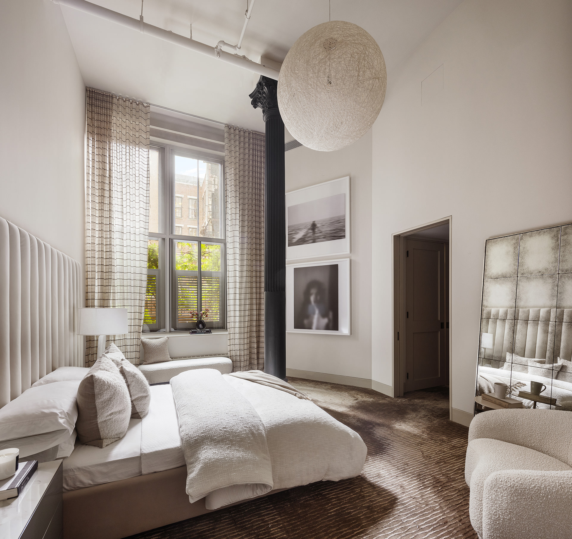 56 Crosby Street, Unit 2A Manhattan, NY 10012 - Photo 18 of 21 a bedroom with bed and a large window