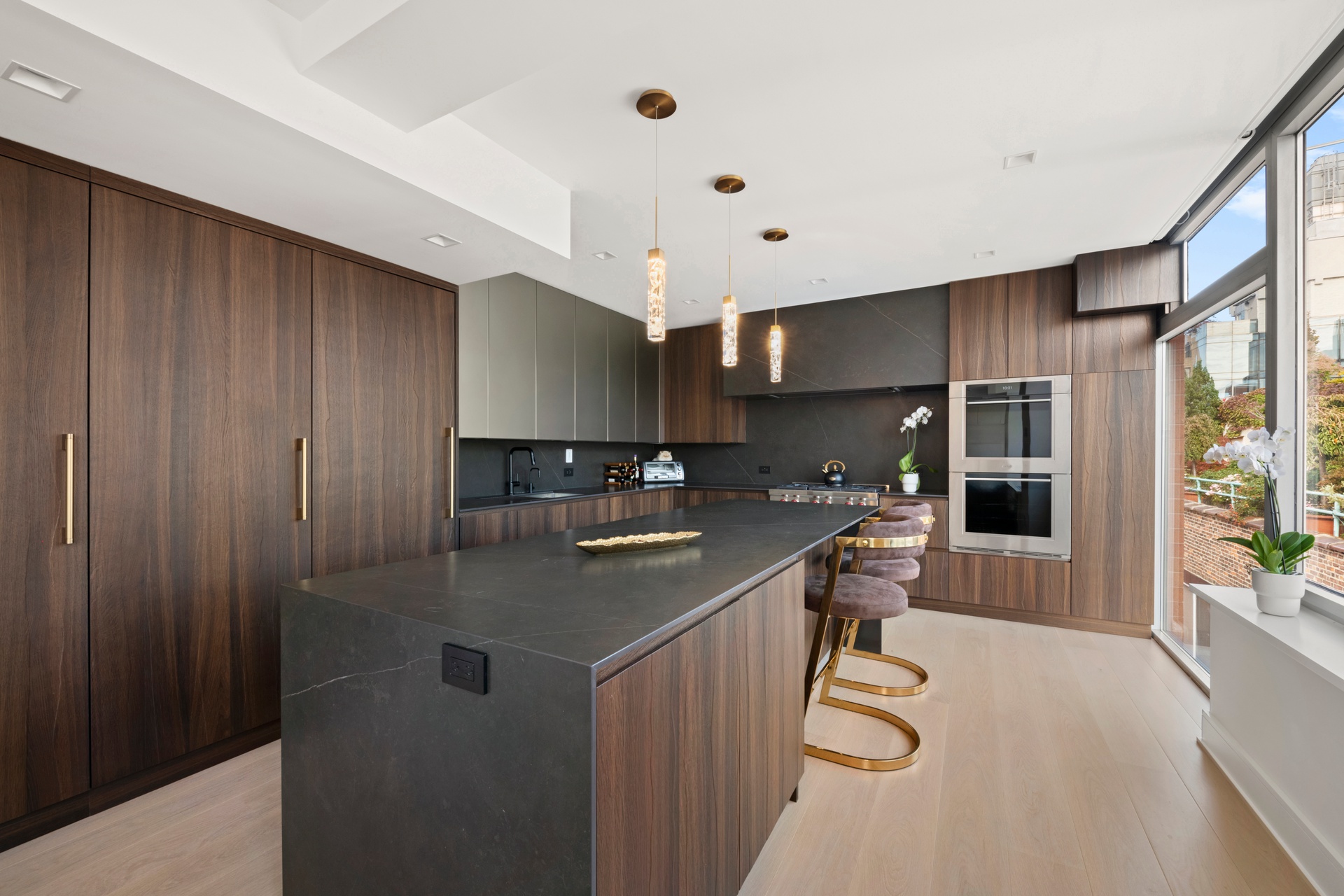 151 West 17th Street, Unit PHF Manhattan, NY 10011 - Photo 6 of 19 a kitchen with stainless steel appliances granite countertop a sink refrigerator and cabinets