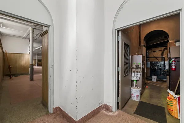 a kitchen with stainless steel appliances granite countertop a refrigerator a sink and wooden cabinets