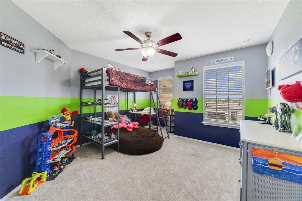 352 Giovani Boulevard Clermont, FL 34715 - Photo 29 of 46 a living room with furniture and a flat screen tv