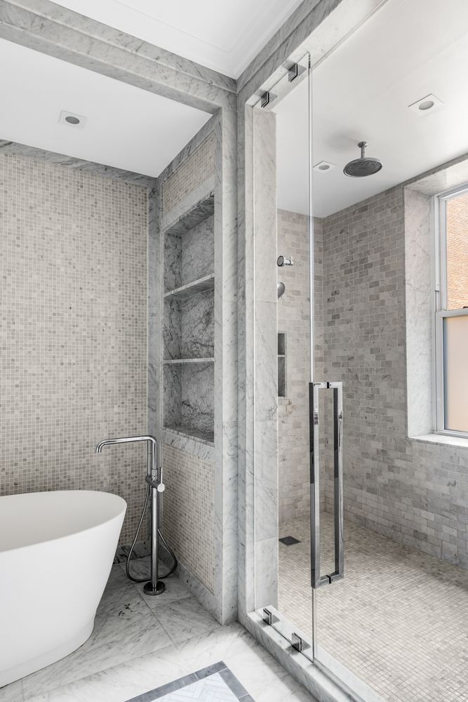 344 West 72nd Street, Unit 1008 Manhattan, NY 10023 - Photo 6 of 35 a bathroom with a bathtub and a shower