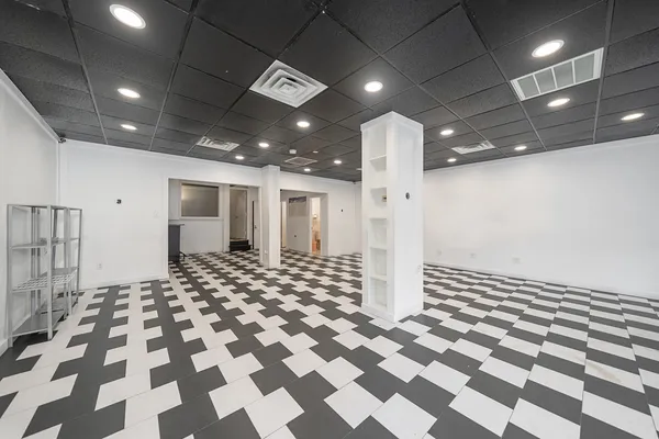 a view of a room with a black white checkered floor