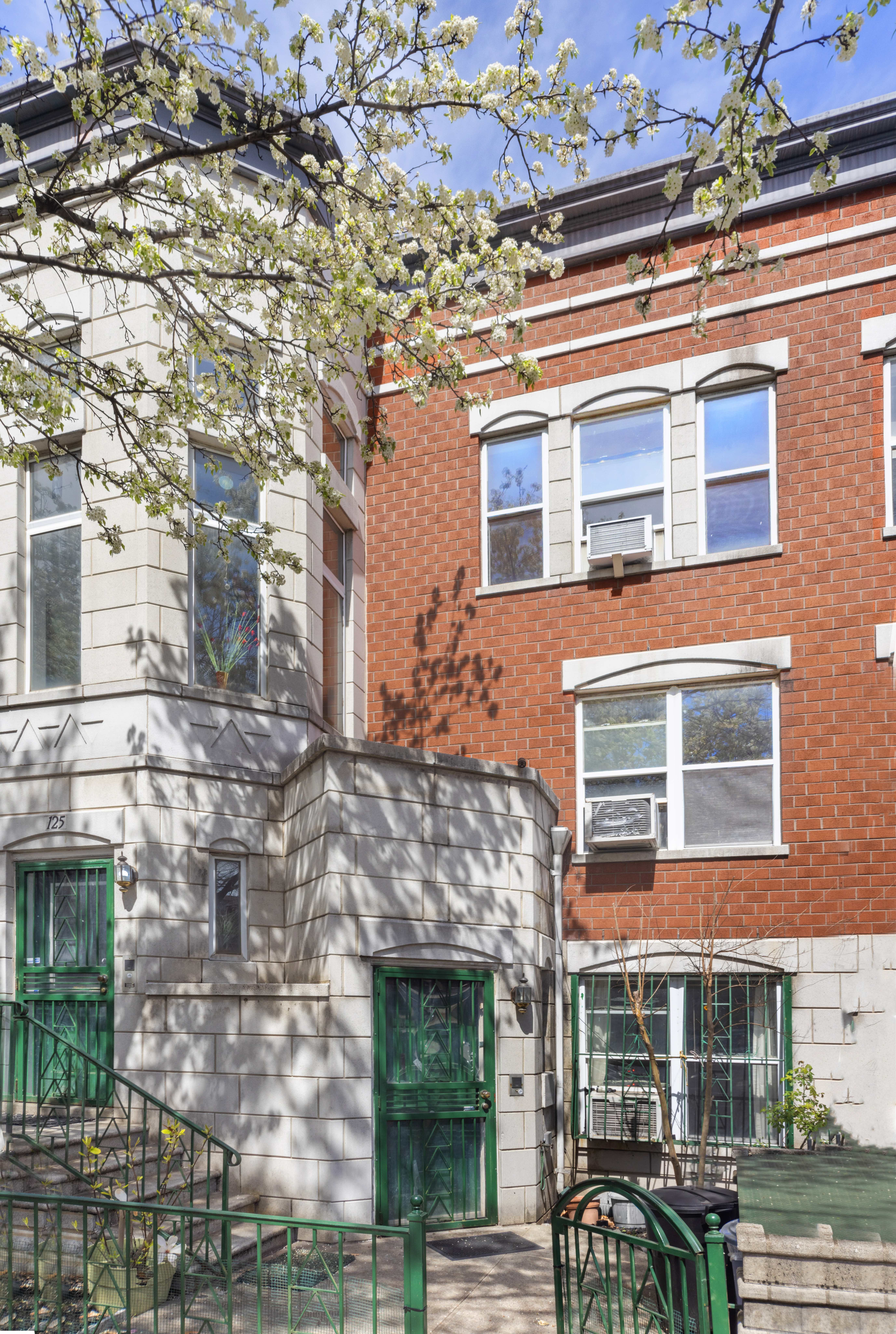 125 West 117th Street Manhattan, NY 10026 - Photo 2 of 23 a front view of a building with balcony