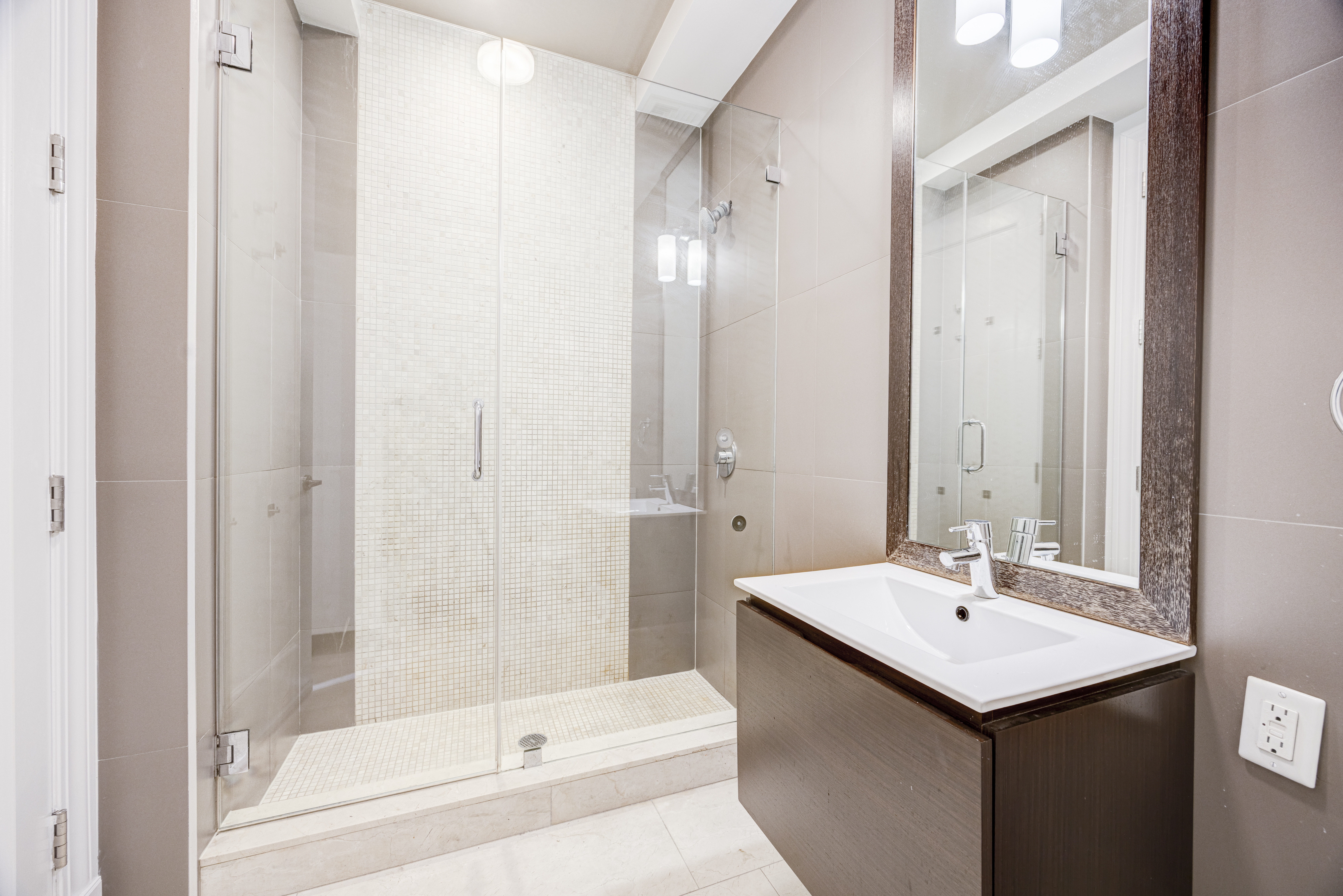 42 Maspeth Avenue, Unit 1D Brooklyn, NY 11211 - Photo 9 of 28 a bathroom with a sink and a mirror