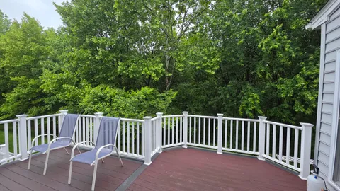 a view of a two chairs in the deck