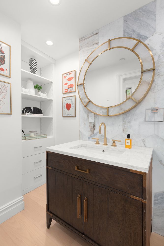 222 East 61st Street Manhattan, NY 10065 - Photo 6 of 28 a bathroom with a sink a mirror and a toilet
