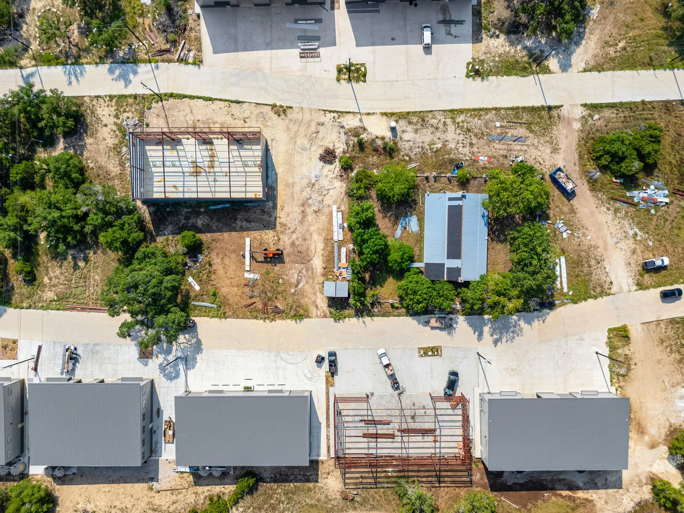 an aerial view of residential houses with outdoor space