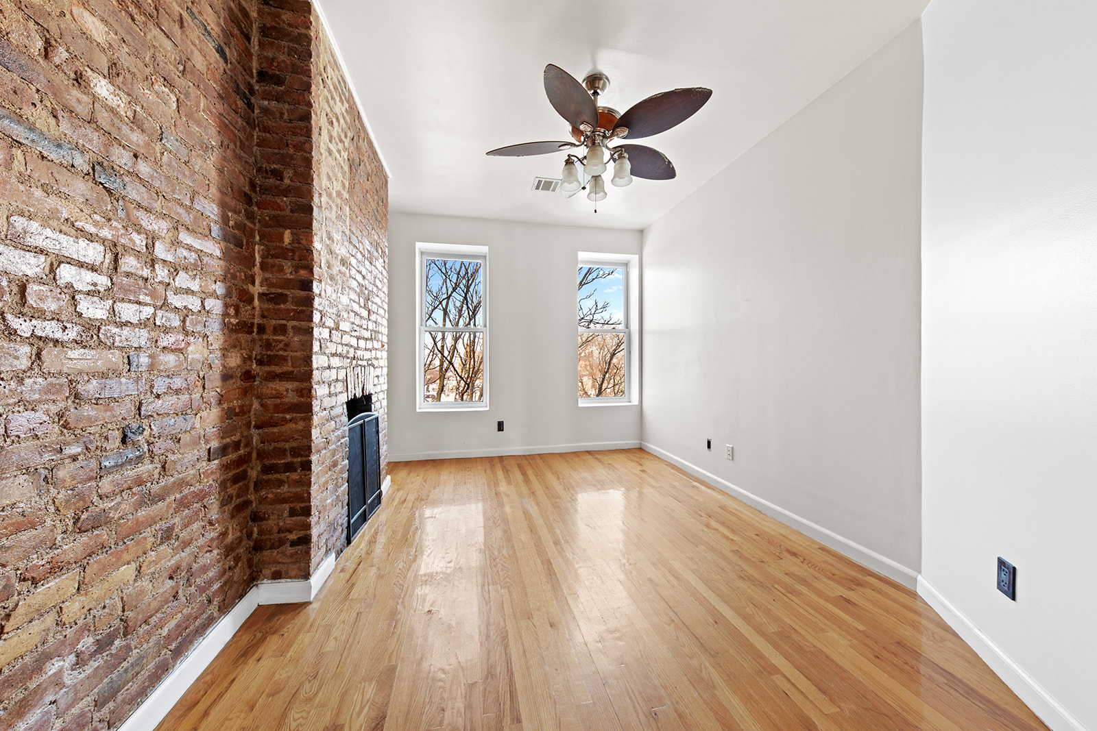 344 7th Avenue, Unit 3 Brooklyn, NY 11215 - Photo 5 of 9 a view of empty room with wooden floor and fan