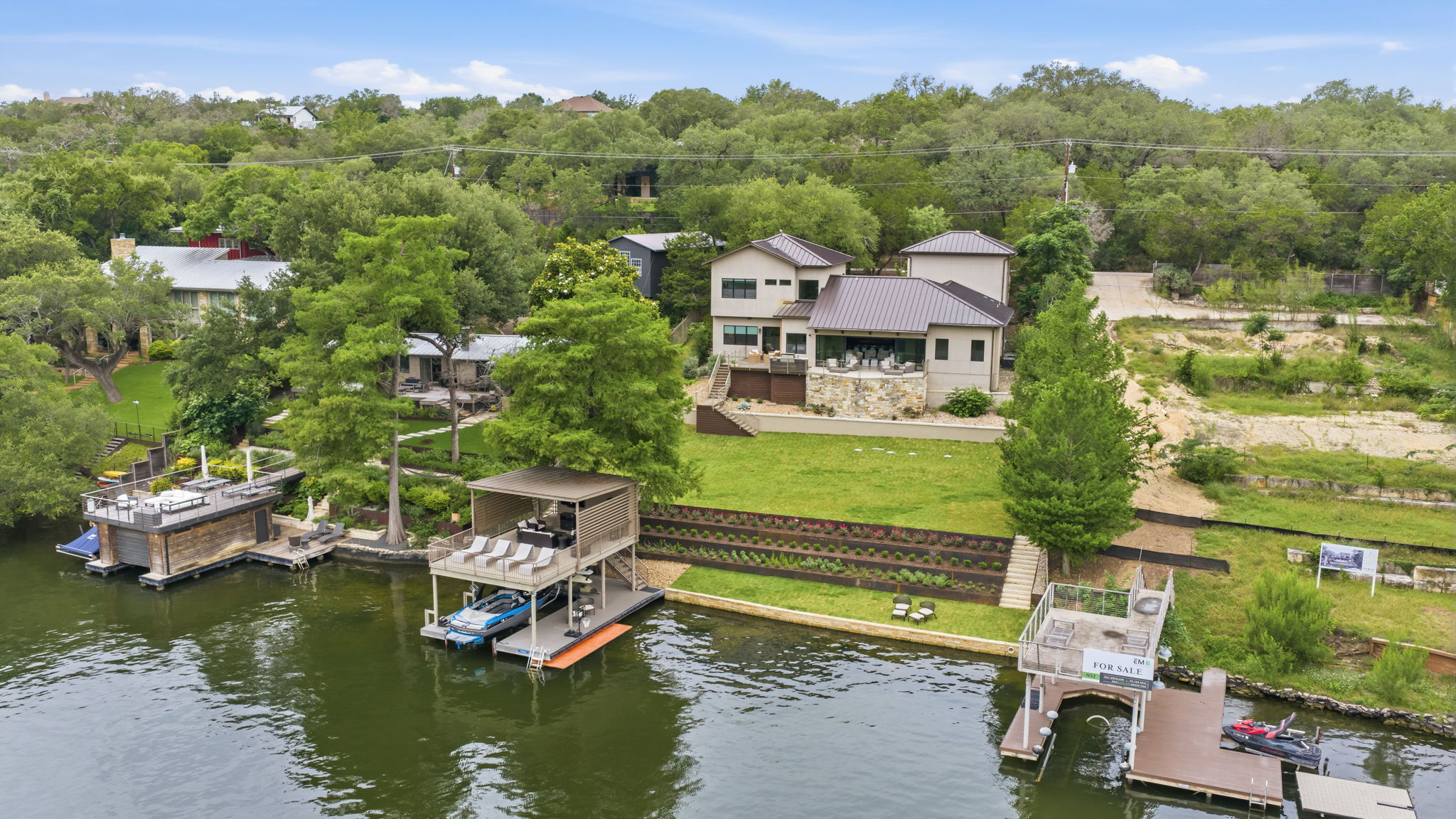 3605 Robbins Road Austin, TX 78730 - Photo 45 of 51 an aerial view of a house with a garden and lake view