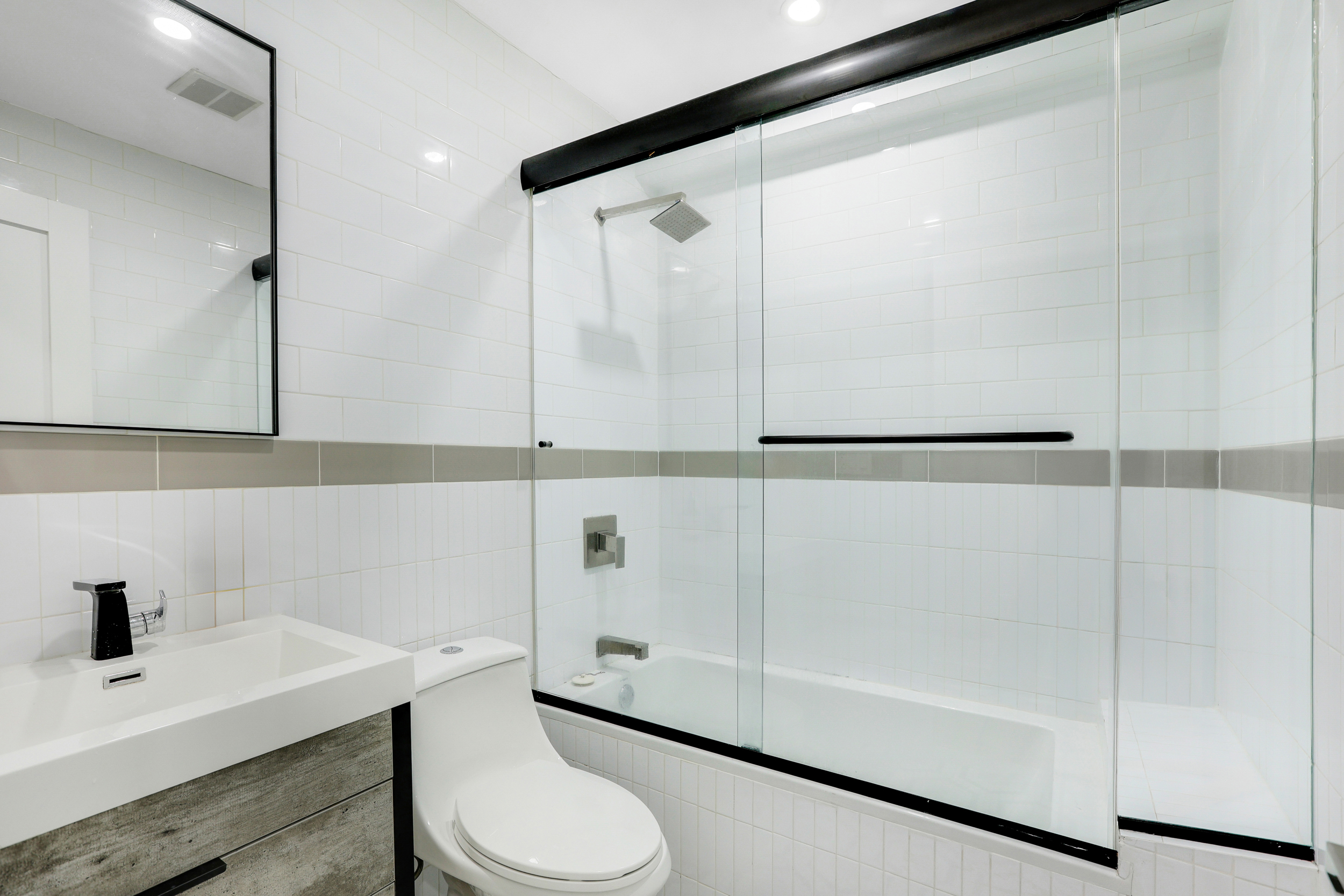 846 Hancock Street, Unit GARDEN Brooklyn, NY 11233 - Photo 8 of 17 a bathroom with a sink a toilet and vanity