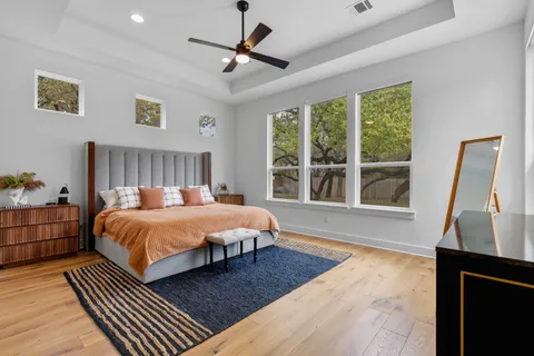 a bedroom with a large bed and a window