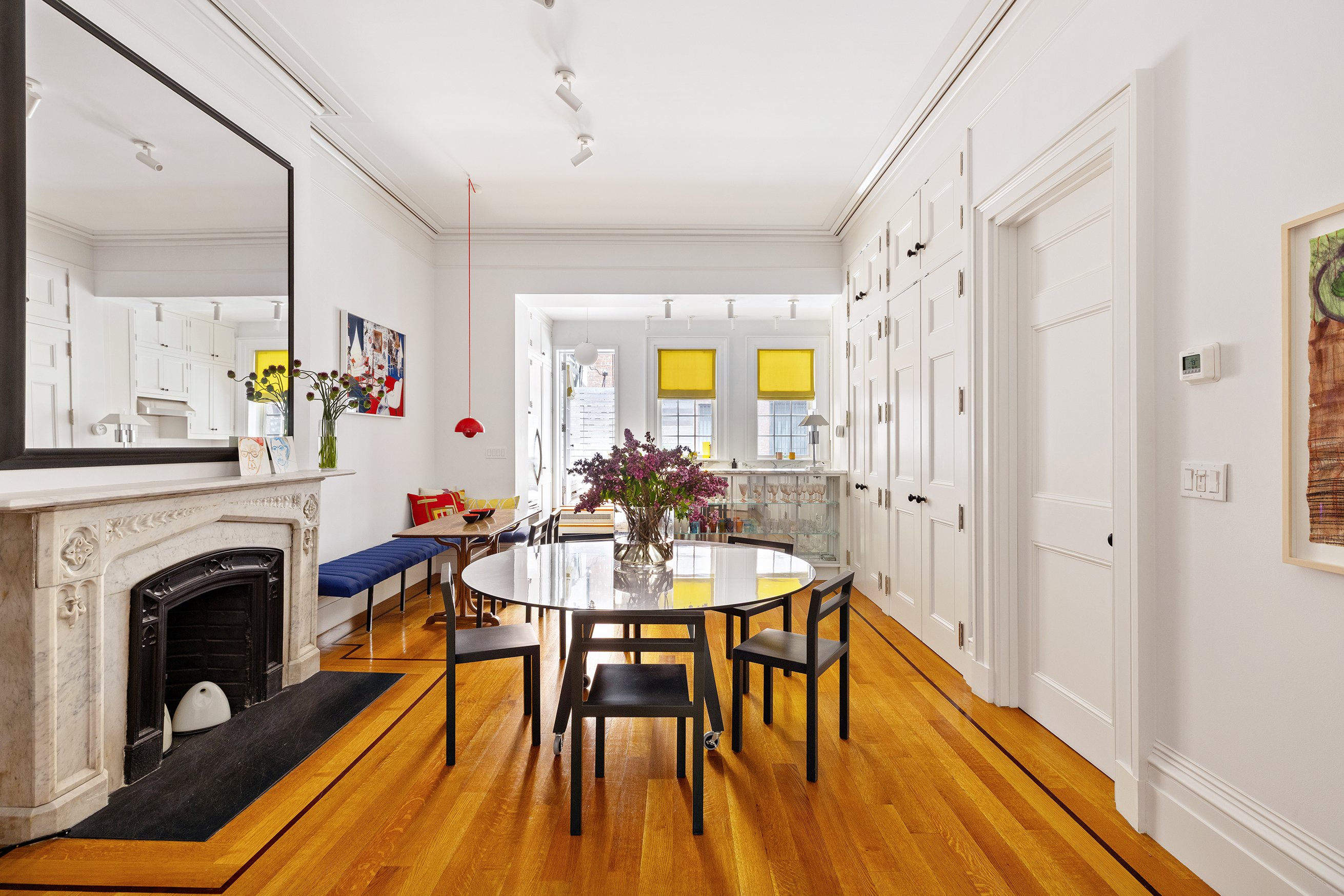 9 West 16th Street, Unit 3 Manhattan, NY 10011 - Photo 4 of 16 a view of a a dining room with furniture a chandelier and wooden floor