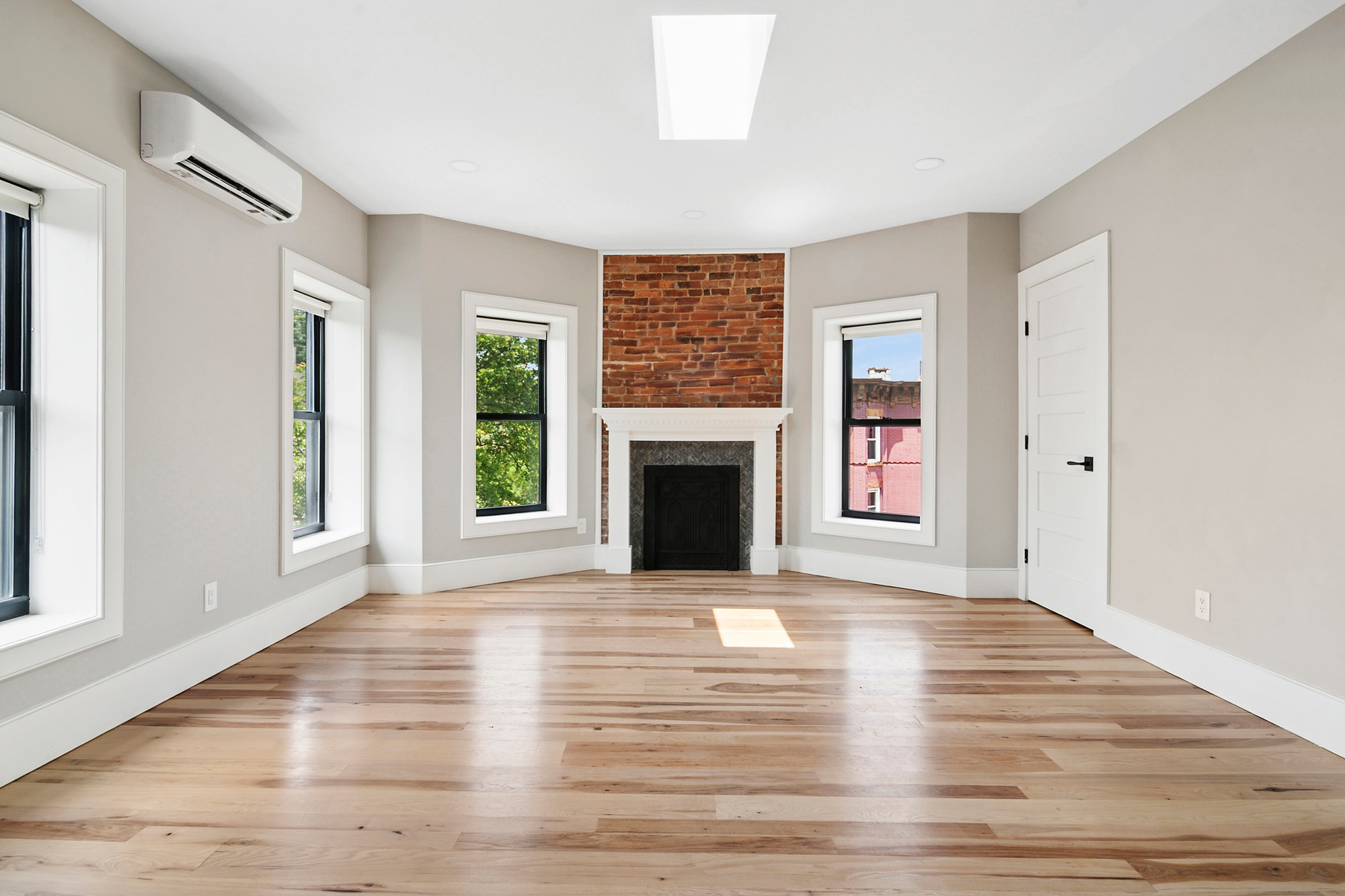 264 Stuyvesant Avenue, Unit 4 Brooklyn, NY 11221 - Photo 1 of 8 a view of an empty room with window and fire place