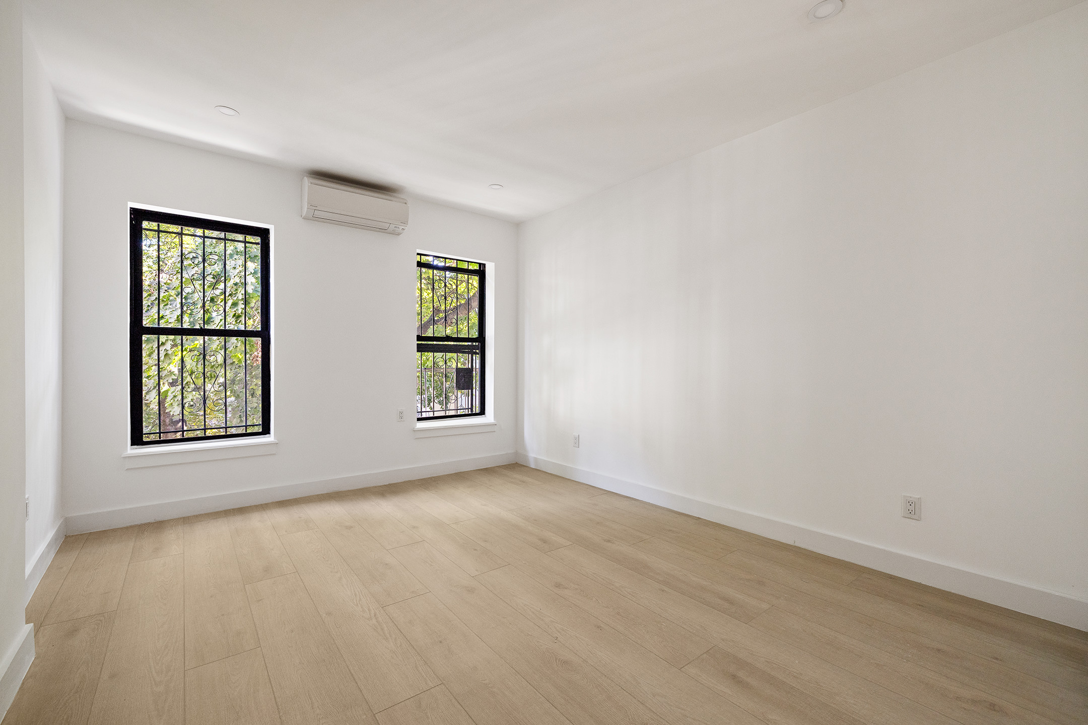1671 8th Avenue, Unit 3L Brooklyn, NY 11215 - Photo 3 of 7 an empty room with windows