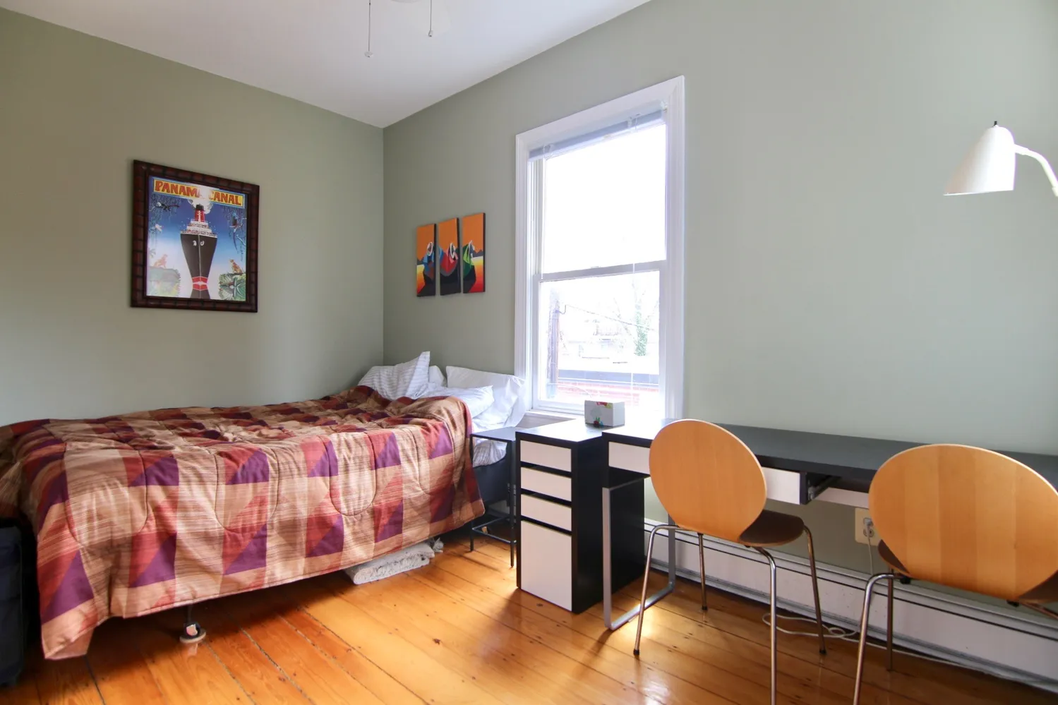 a bedroom with bed and a window