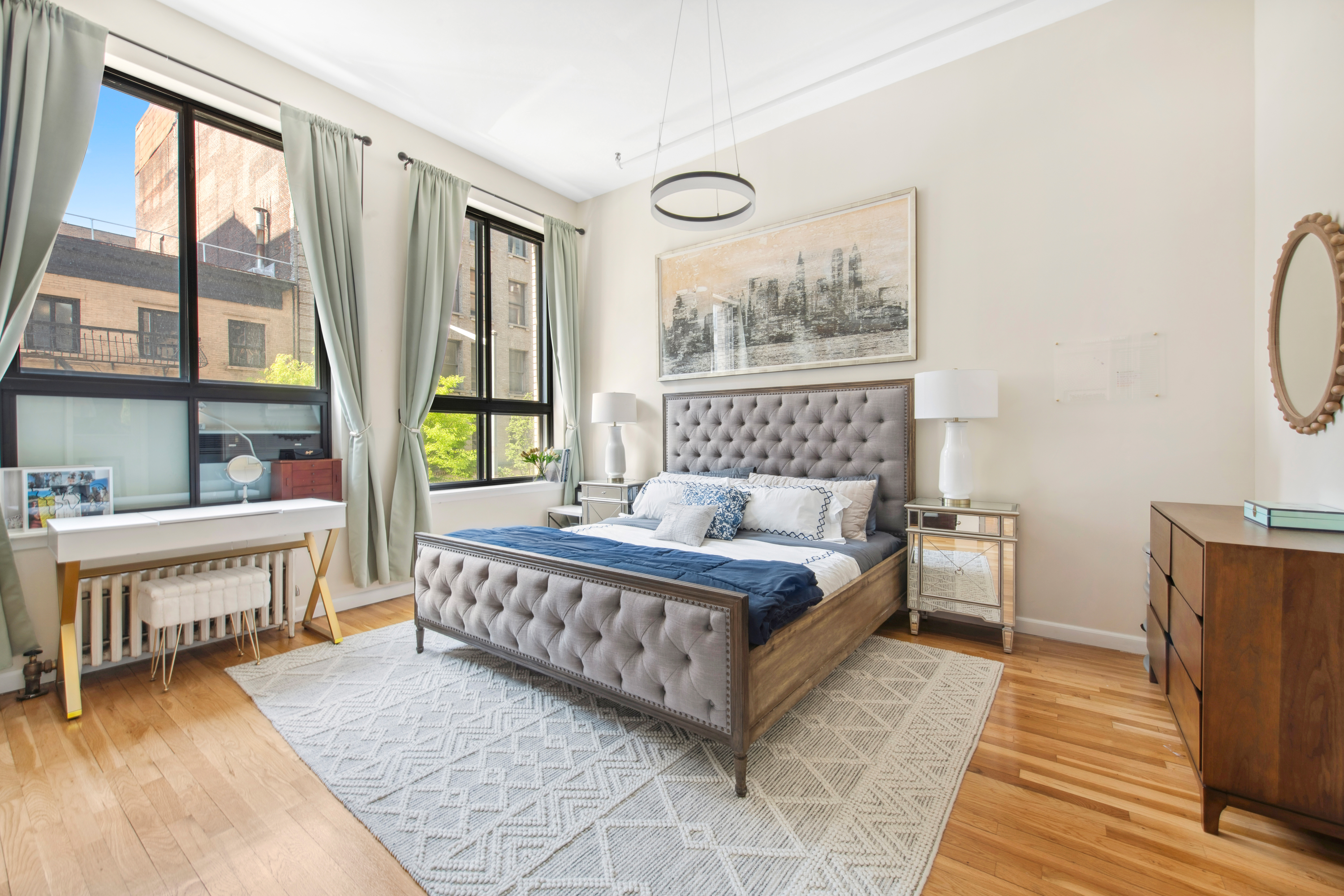 112 West 18th Street, Unit 2A Manhattan, NY 10011 - Photo 6 of 10 a spacious bedroom with a bed and a window