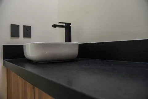 a view of an empty room with wooden floor and closet