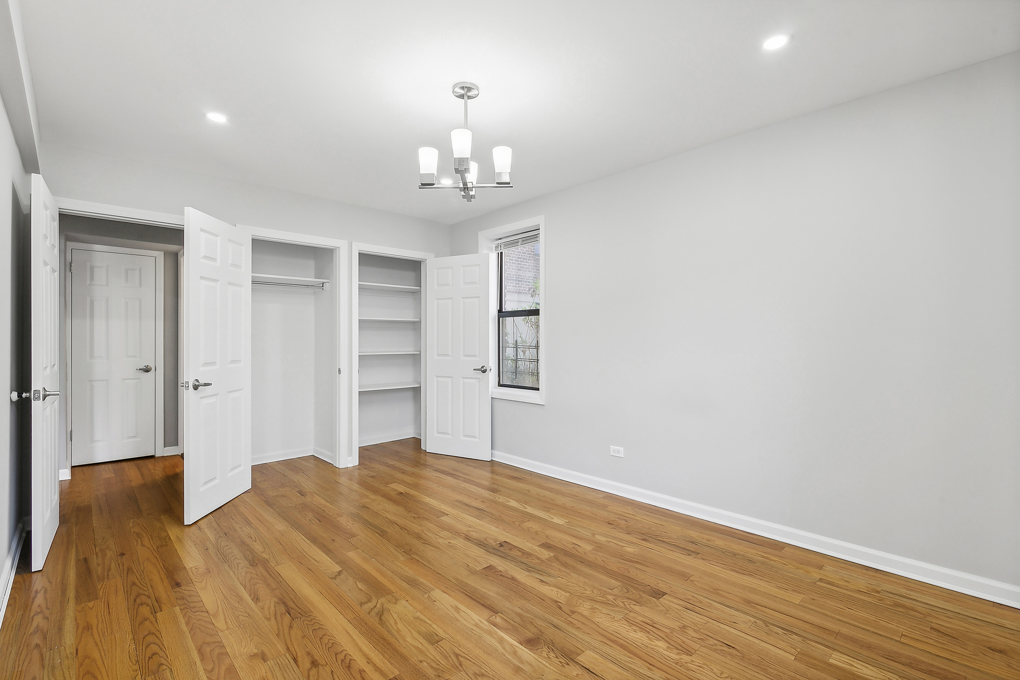 40 89th Street, Unit 1F Brooklyn, NY 11209 - Photo 8 of 13 a bedroom with a bed and wooden floor