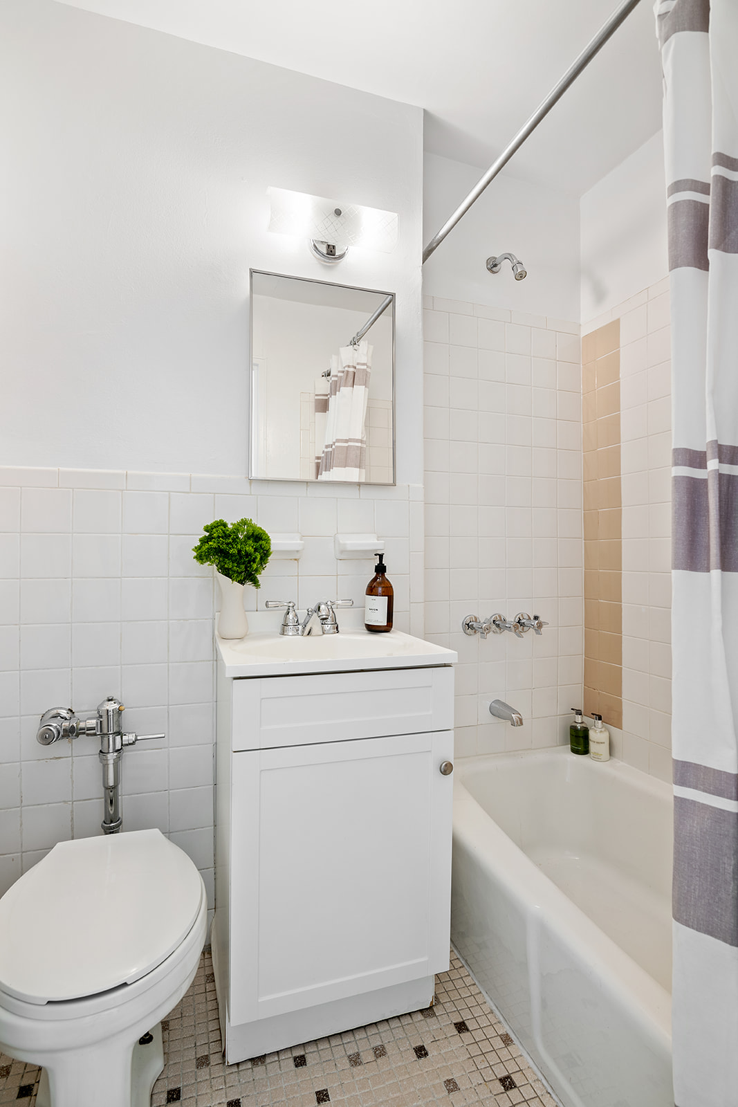 166 West 76th Street, Unit 4B Manhattan, NY 10023 - Photo 4 of 6 a bathroom with a sink a toilet and shower