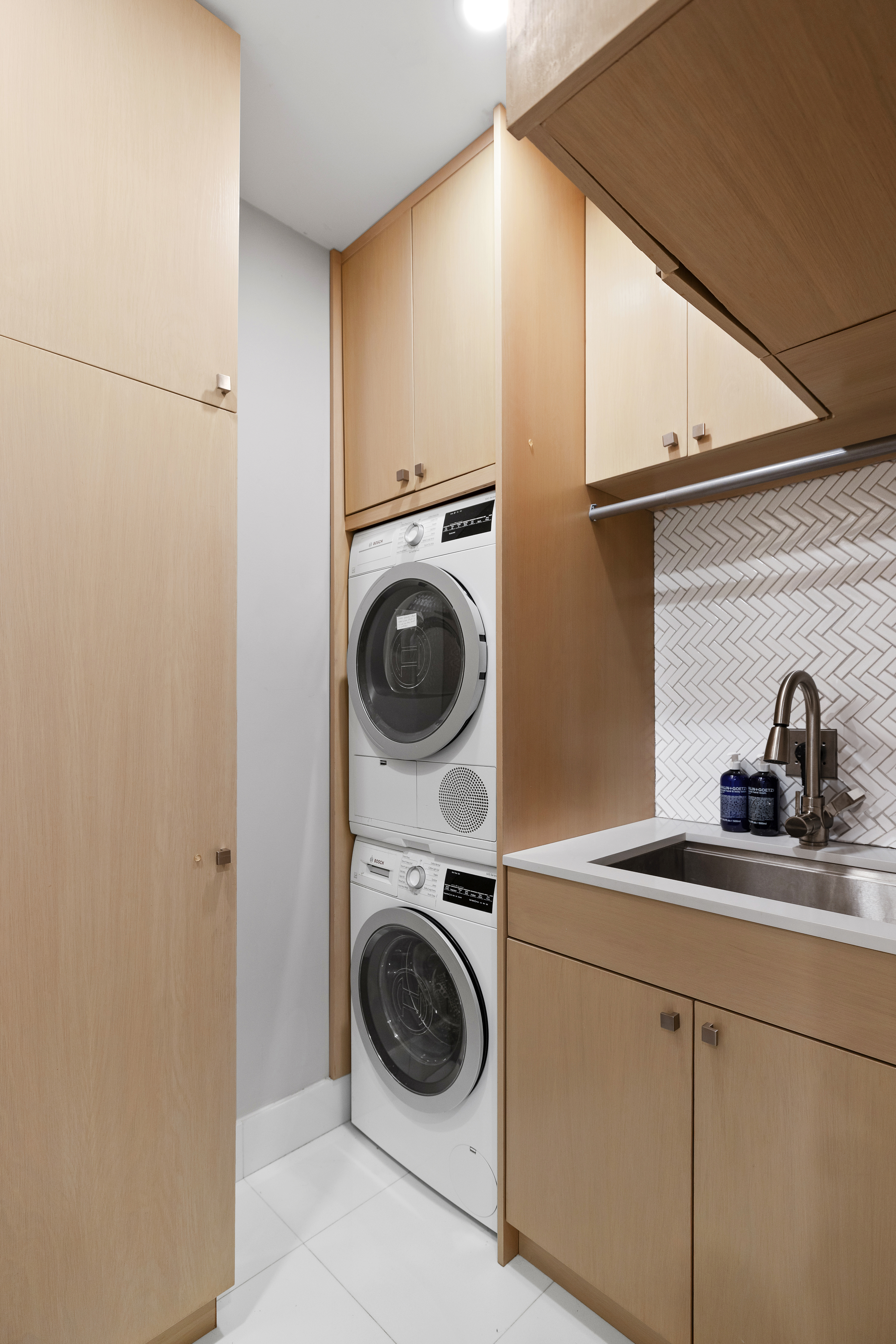 129 West 123rd Street, Unit 3 Manhattan, NY 10027 - Photo 15 of 20 a utility room with sink dryer and washer