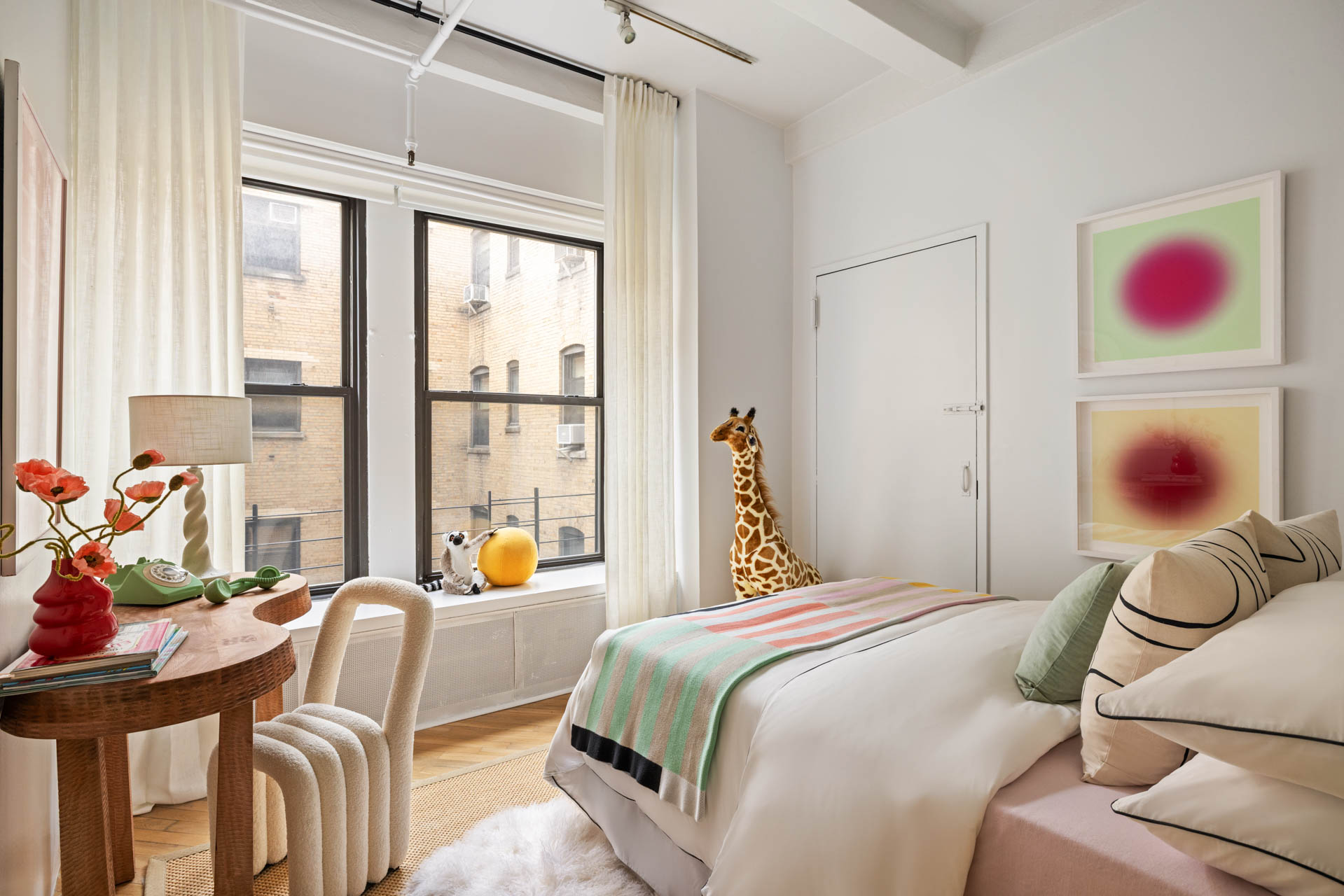 130 West 17th Street, Unit 5S Manhattan, NY 10011 - Photo 13 of 17 a bedroom with two beds and a large window