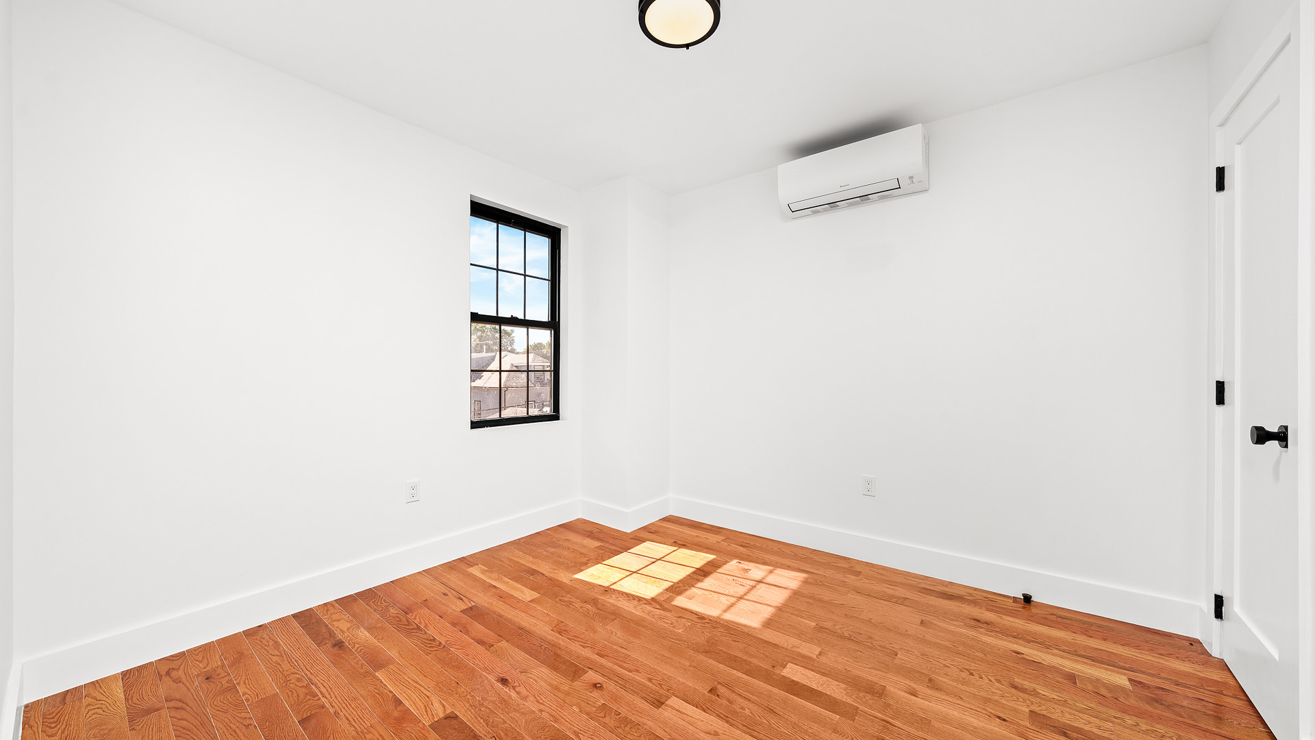 170-10 118th Avenue Queens, NY 11434 - Photo 5 of 7 a view of empty room with wooden floor