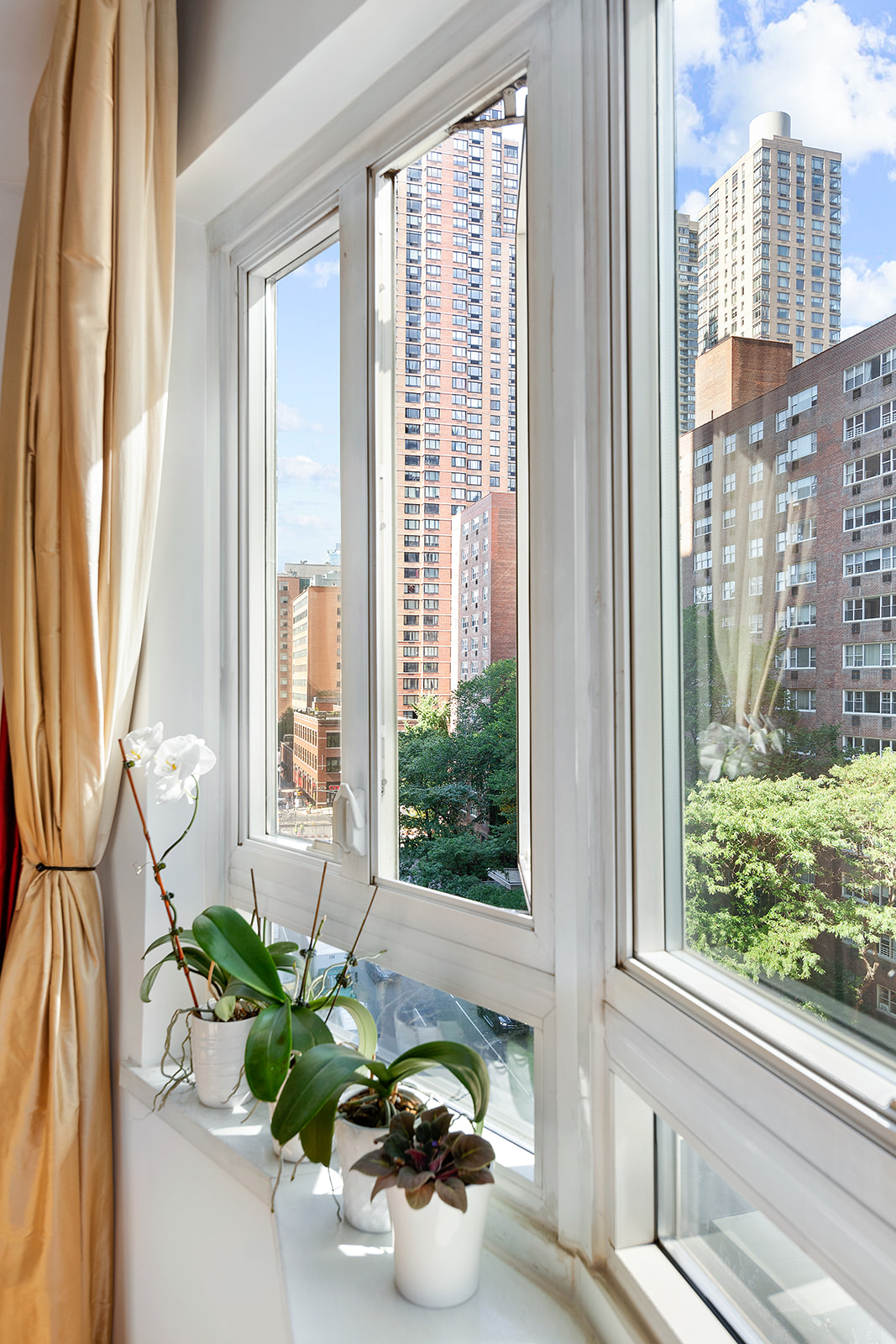 333 West 57th Street, Unit 8B Manhattan, NY 10019 - Photo 5 of 8 a view of a flower chair in front of a window