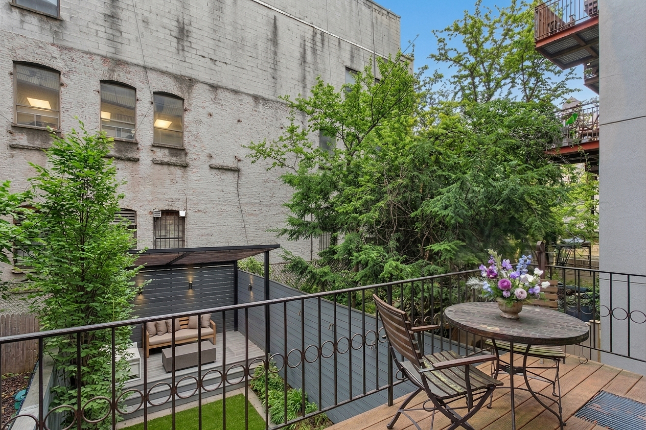 165 West 126th Street Manhattan, NY 10027 - Photo 14 of 40 a balcony with table and chairs