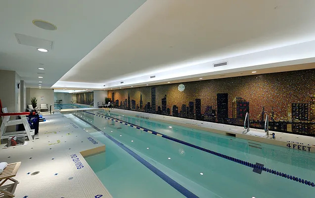 845 United Nations Plaza, Unit 56E Manhattan, NY 10017 - Photo 26 of 28 a lobby with a table and chairs