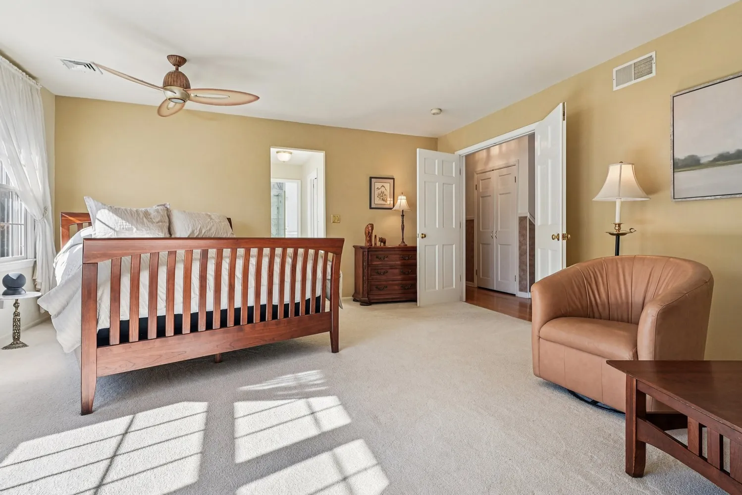 a bedroom with furniture and a window