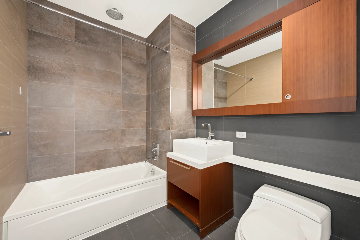 a bathroom with a sink a toilet and bathtub