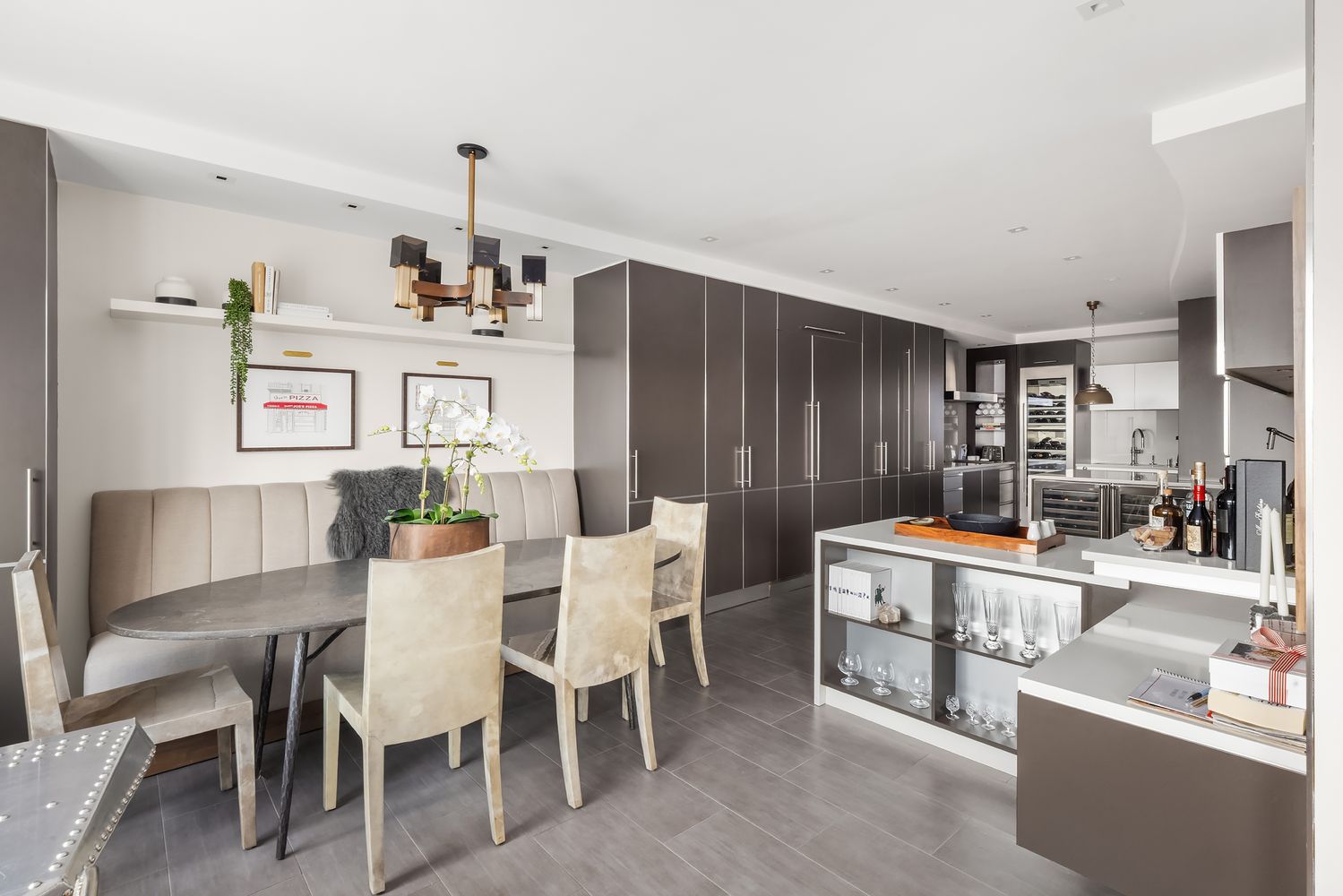 a room with a large window and a potted plant