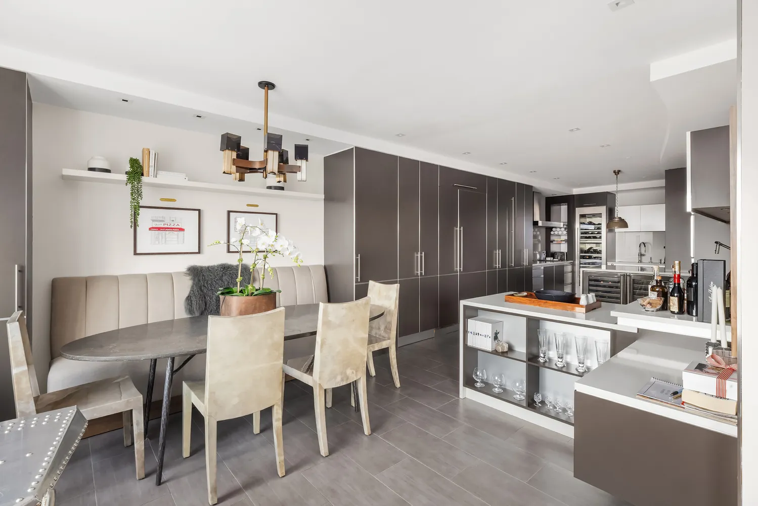 a room with a large window and a potted plant