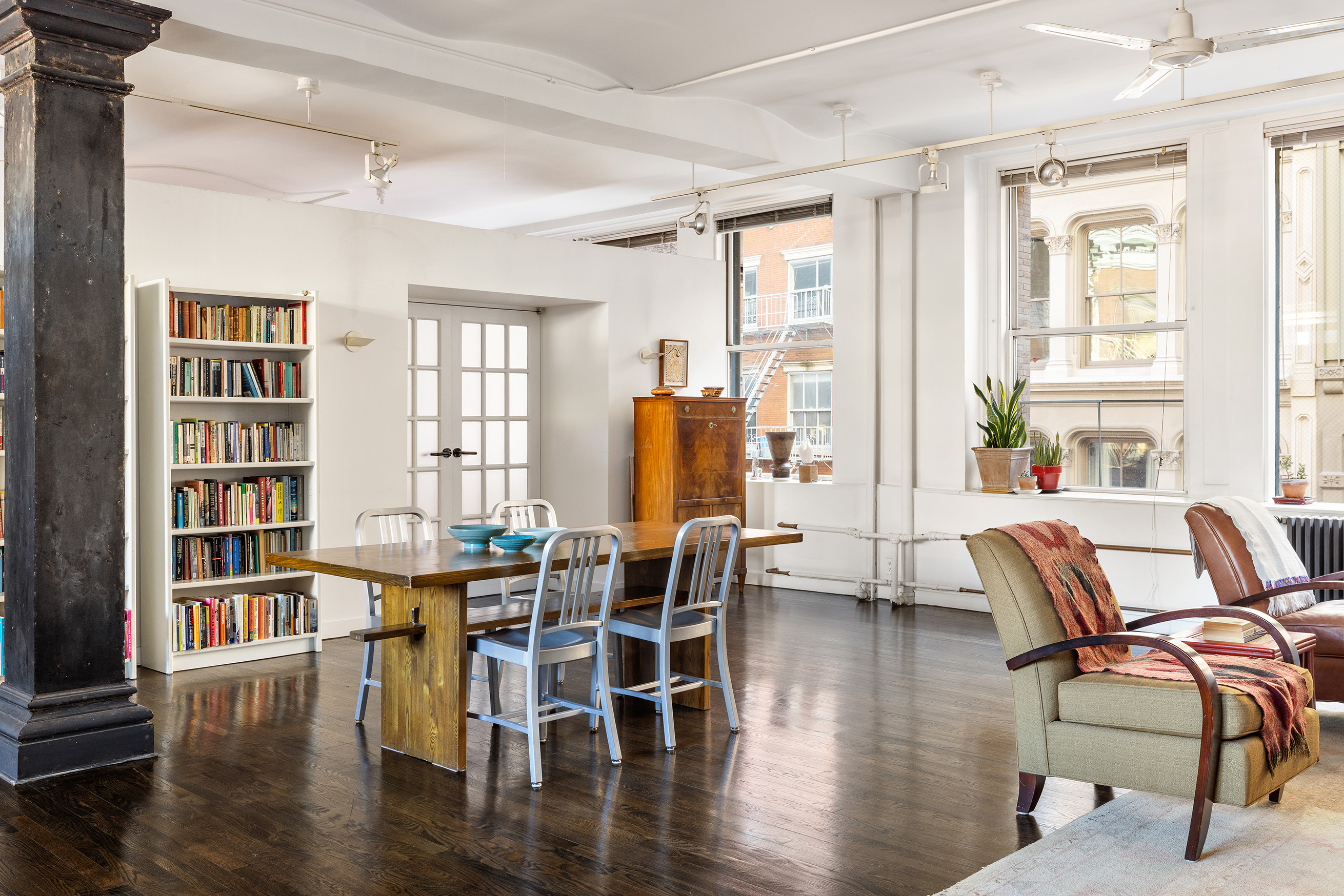 45 Lispenard Street, Unit 3E Manhattan, NY 10013 - Photo 2 of 13 a dining room with wooden floor and furniture