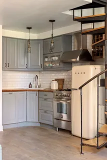 a kitchen with stainless steel appliances granite countertop a sink and cabinets