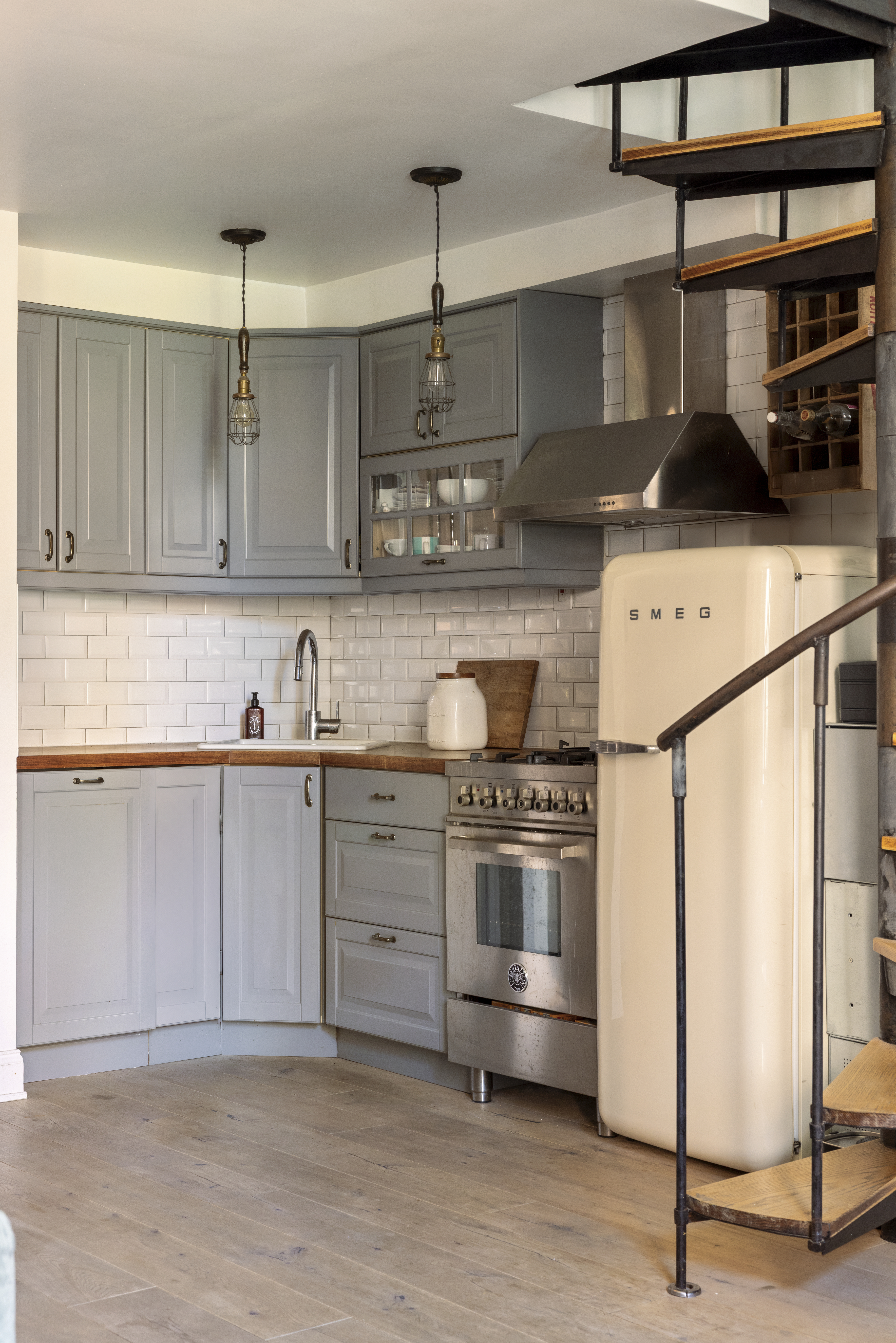160 East 26th Street, Unit 4B Manhattan, NY 10010 - Photo 3 of 7 a kitchen with stainless steel appliances granite countertop a sink and cabinets